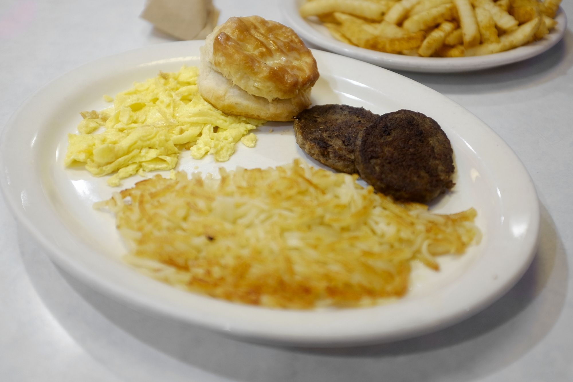 One Egg Plate with Sausage, Hashbrowns, and Biscuit