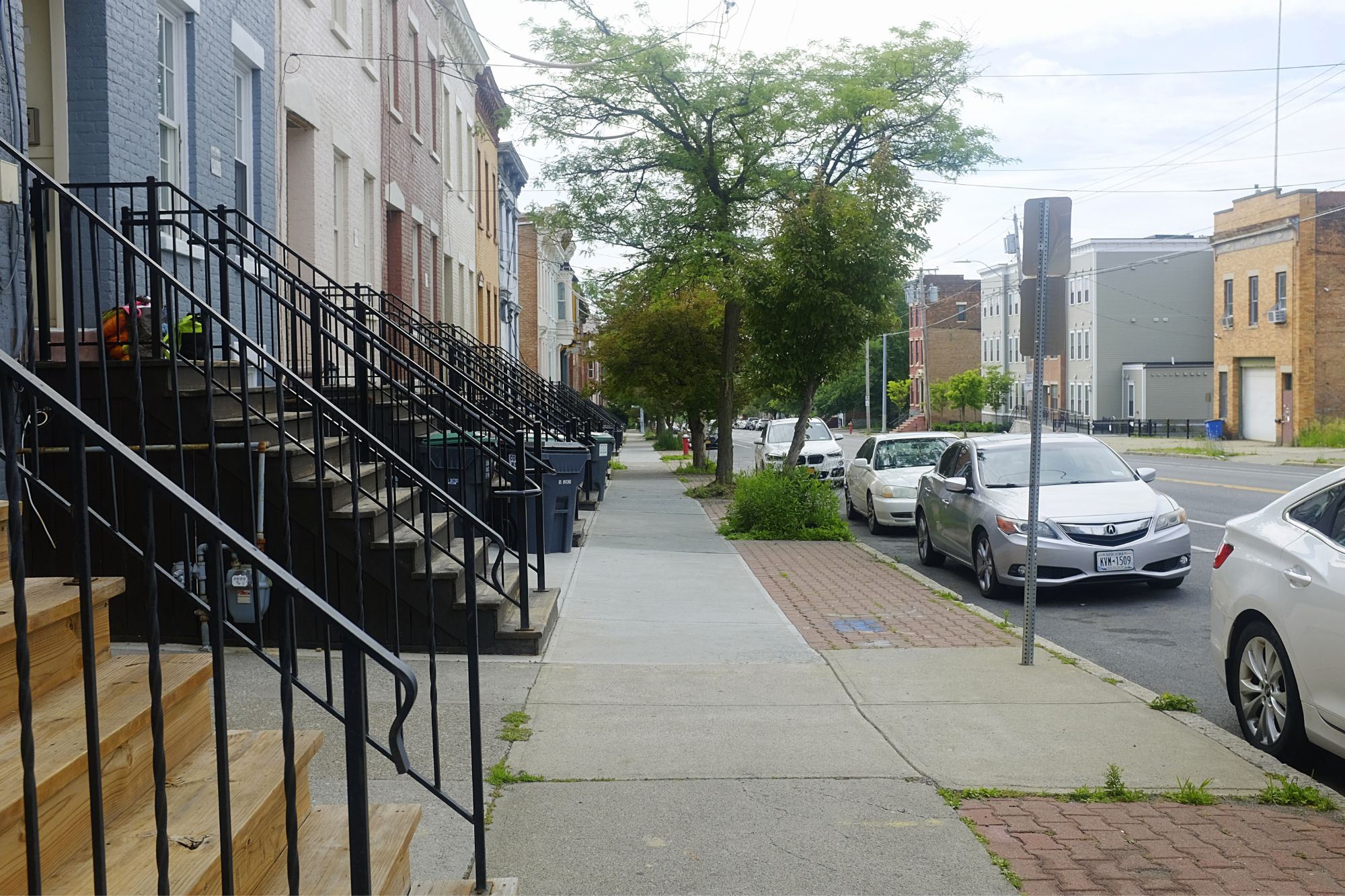 View down a city street with stoops