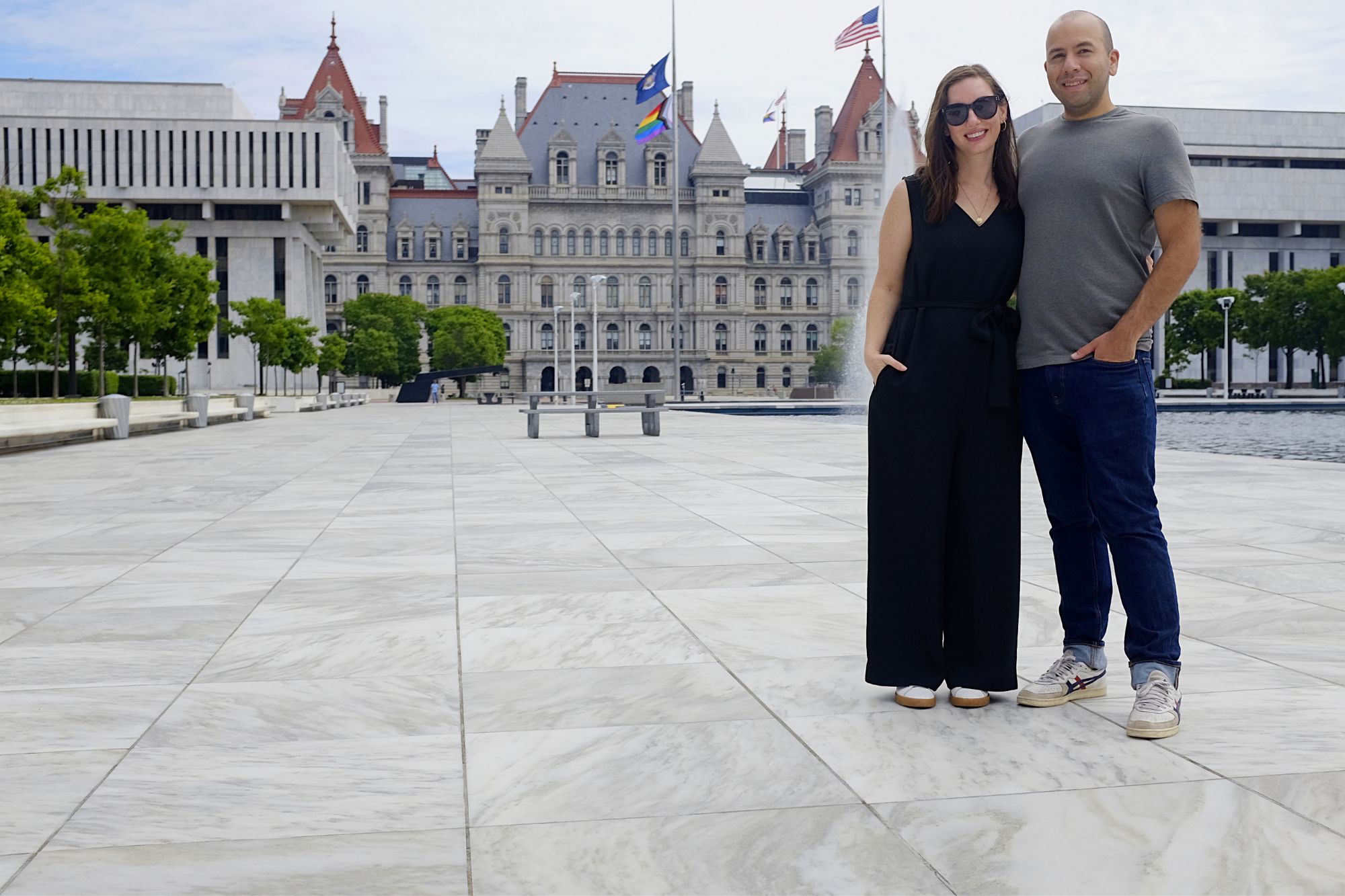 Alyssa and Michael stand in front of the NY state capitol building