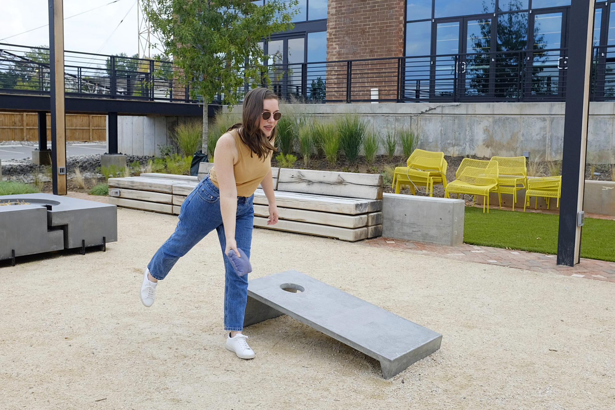 Alyssa plays cornhole