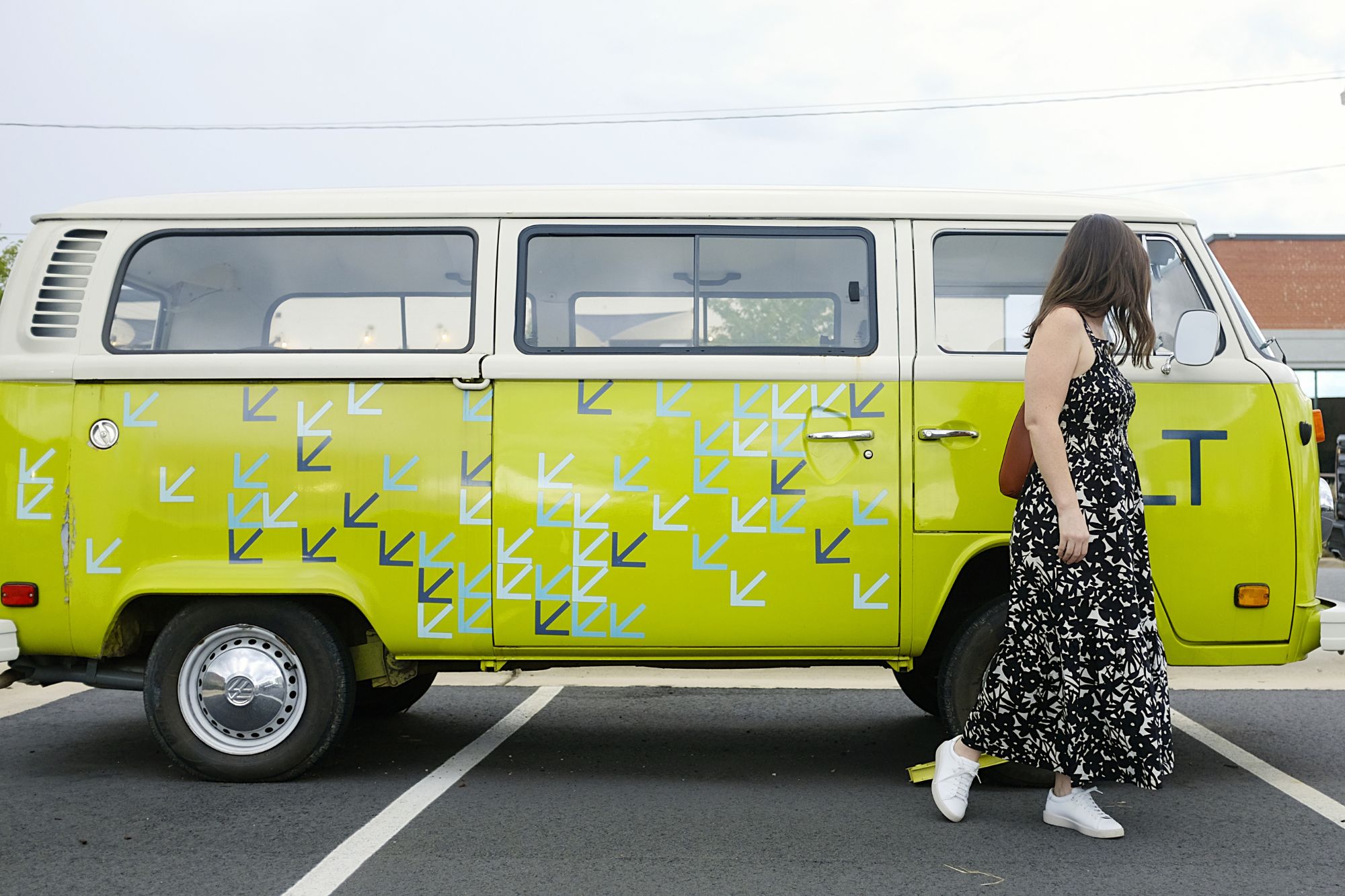 Alyssa stands in front of a VW bus wearing The Smock Dress