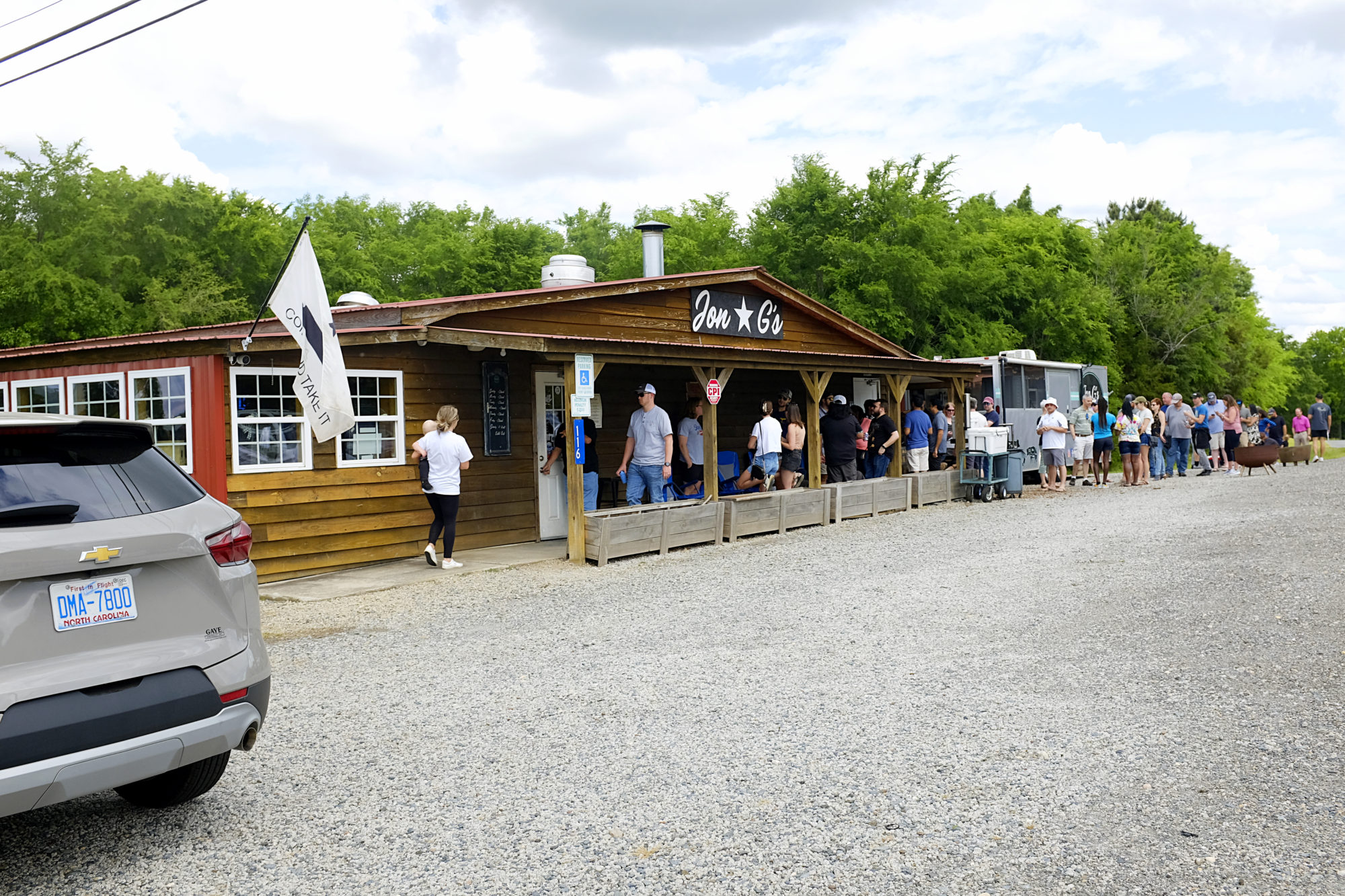 A long line forms outside of Jon G's restaurant