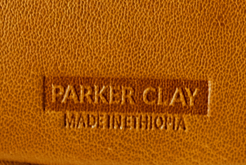 Parker Clay logo embossed in leather