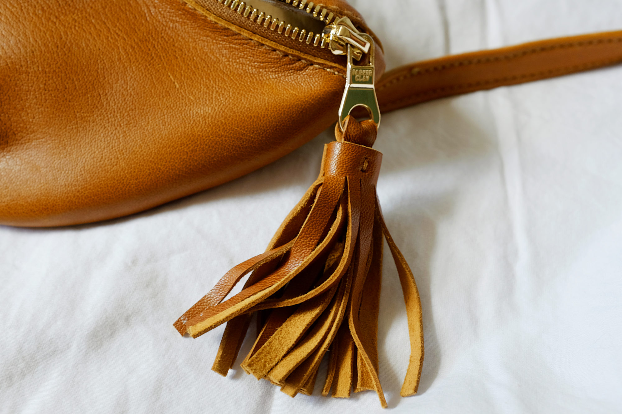 A closeup of the Sodo Belt Bag Tassel