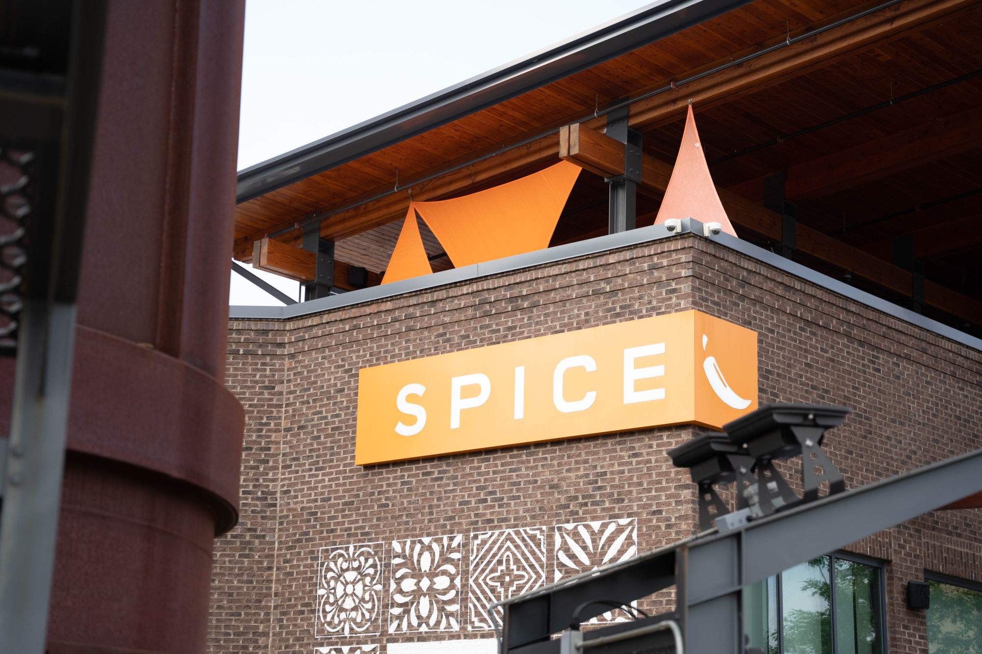 View of the front side of Spice Asian Kitchen - and the rooftop patio is visible