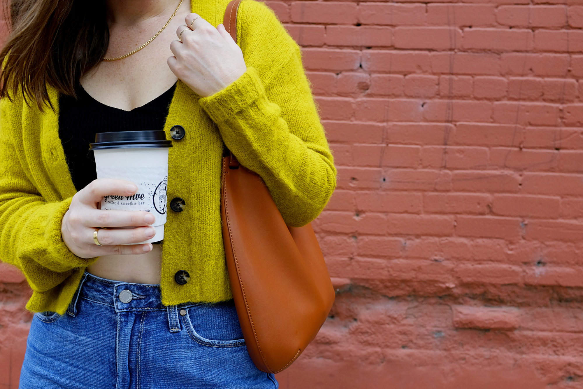 Alyssa wears The Alpaca Cropped V Cardigan from Everlane in a close up shot