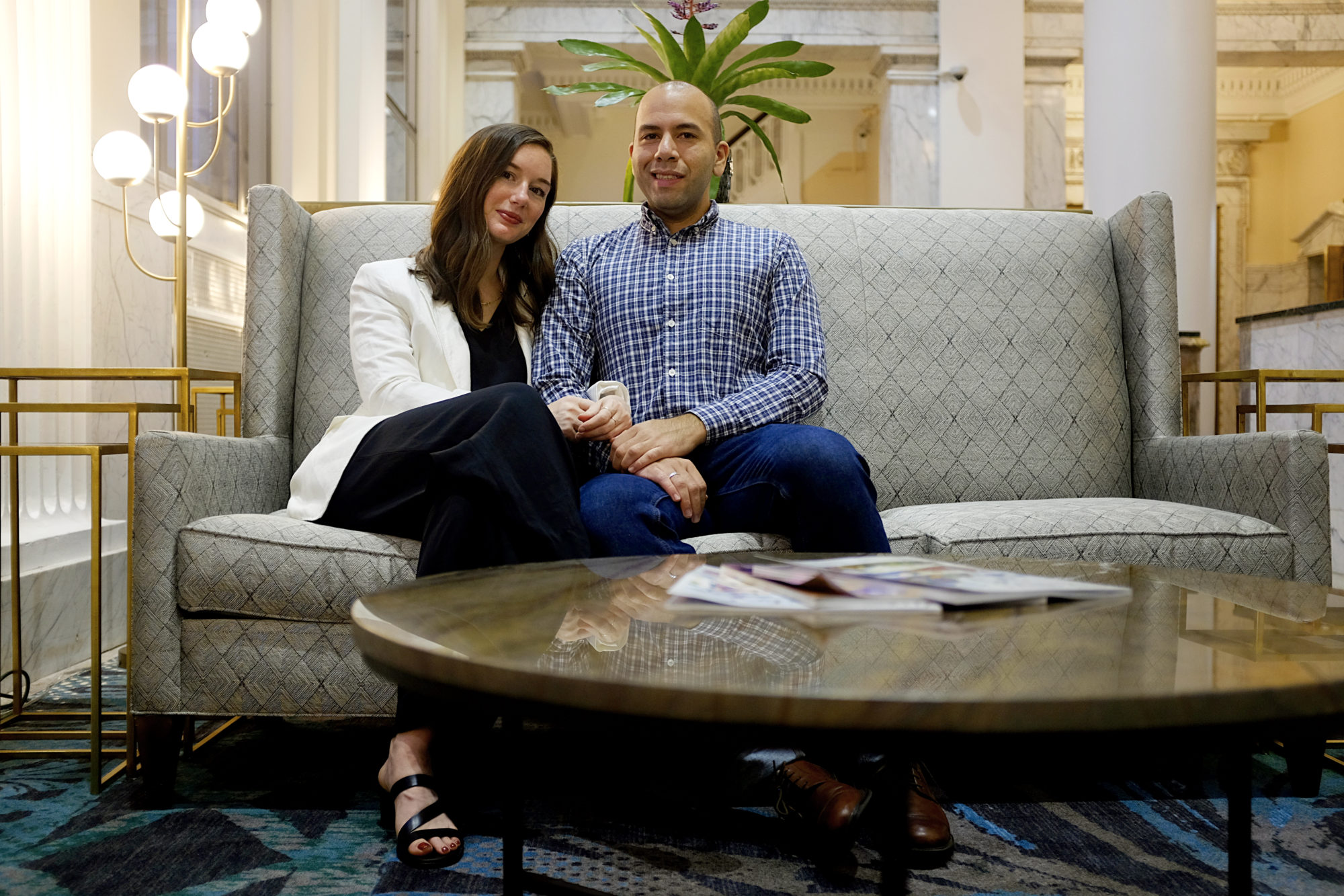 Alyssa and MIchael on a sofa in the lobby