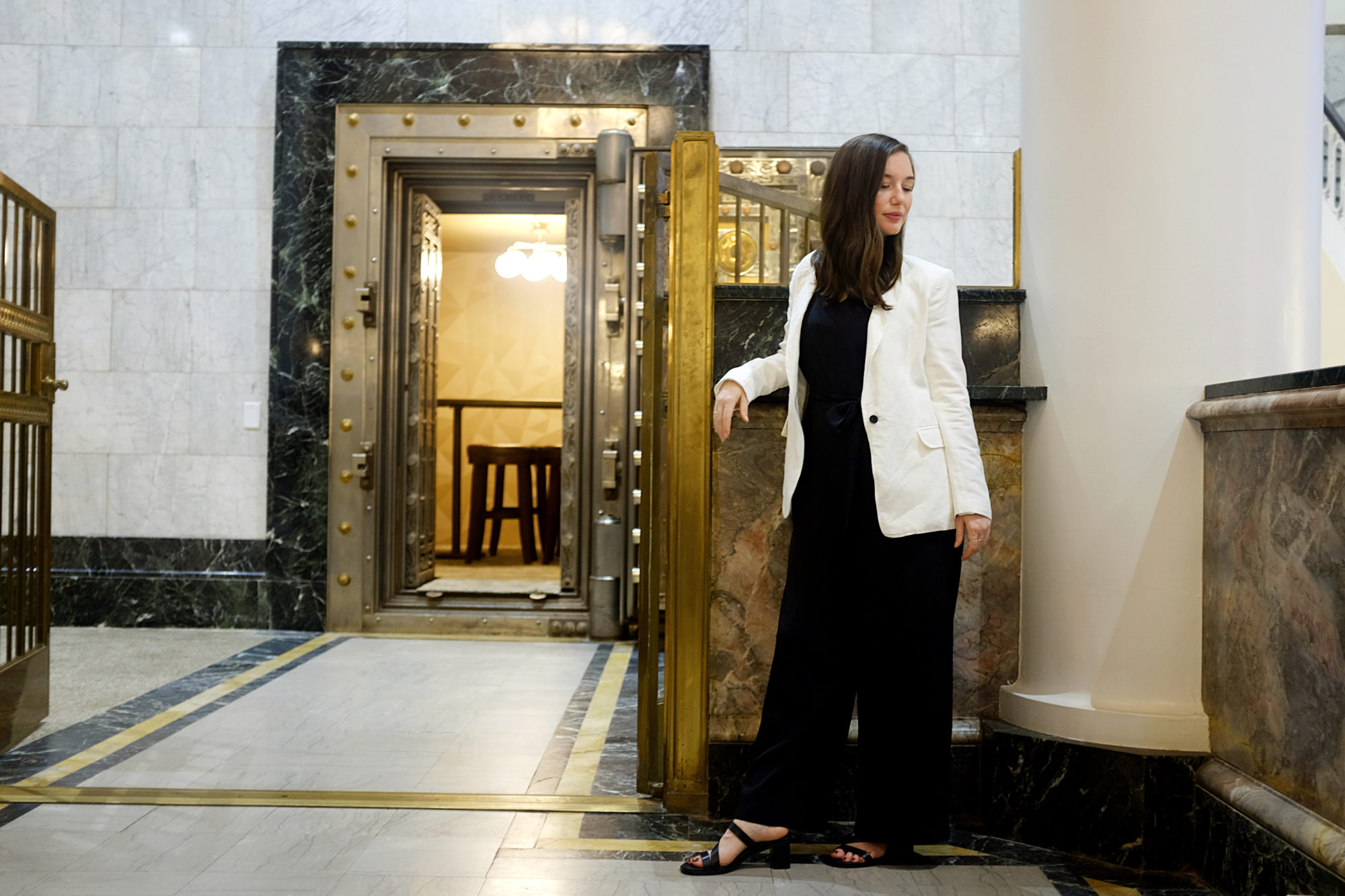 Alyssa stands in front of the vault at The Liberty Trust