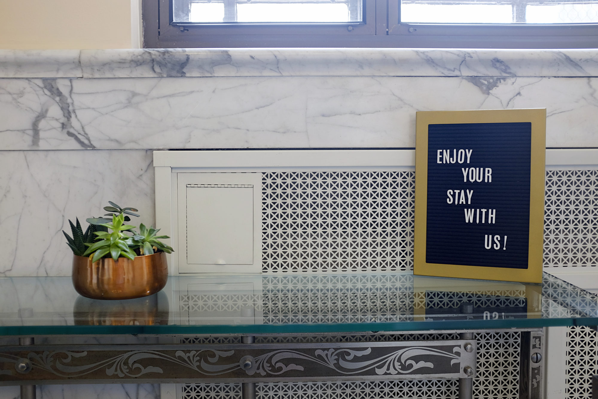 A letterboard reads "Enjoy your stay with us"