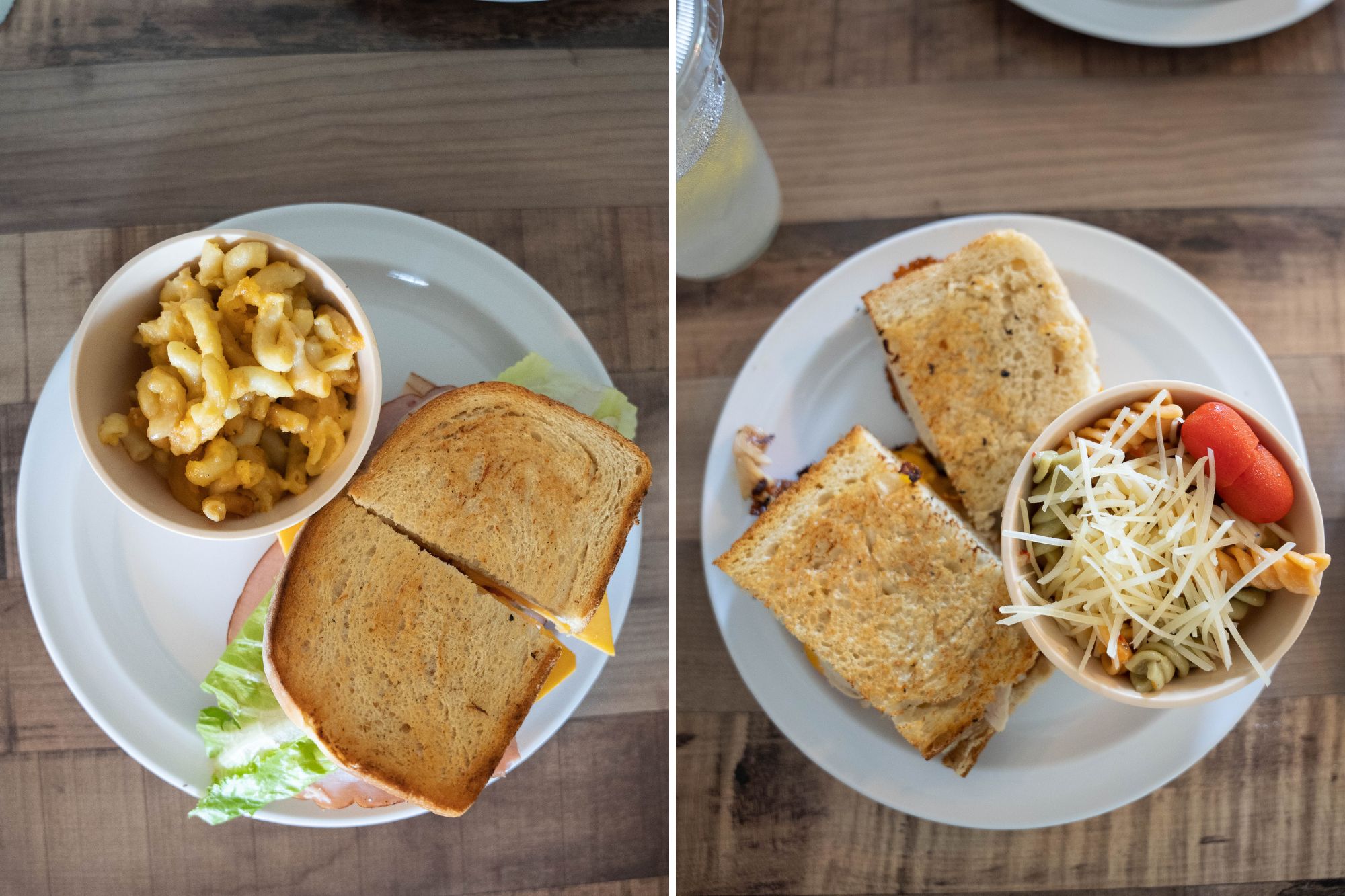 a top-down view of two sandwiches with pasta sides