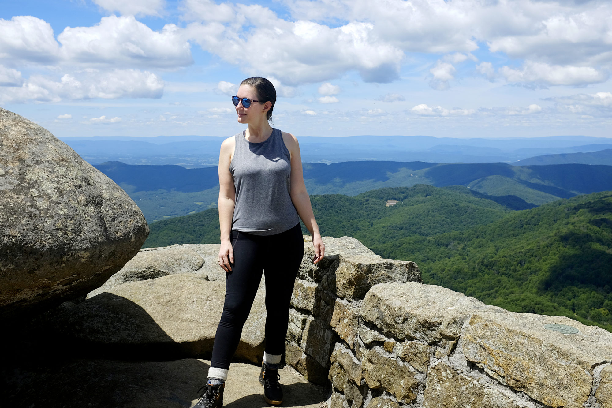 Alyssa stands at the summit of Sharp Top