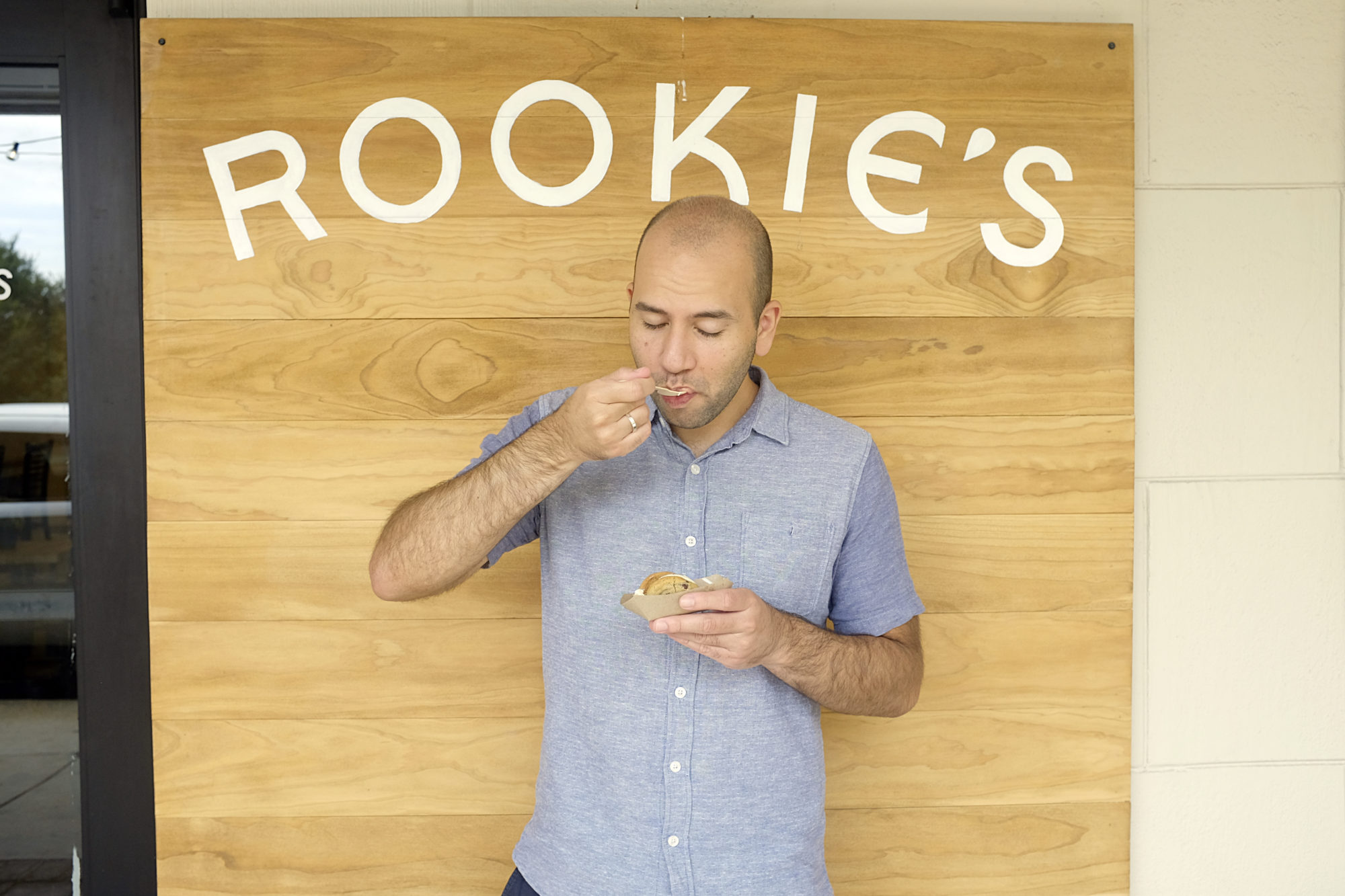 Michael holds an ice cream sandwich at Rookie's
