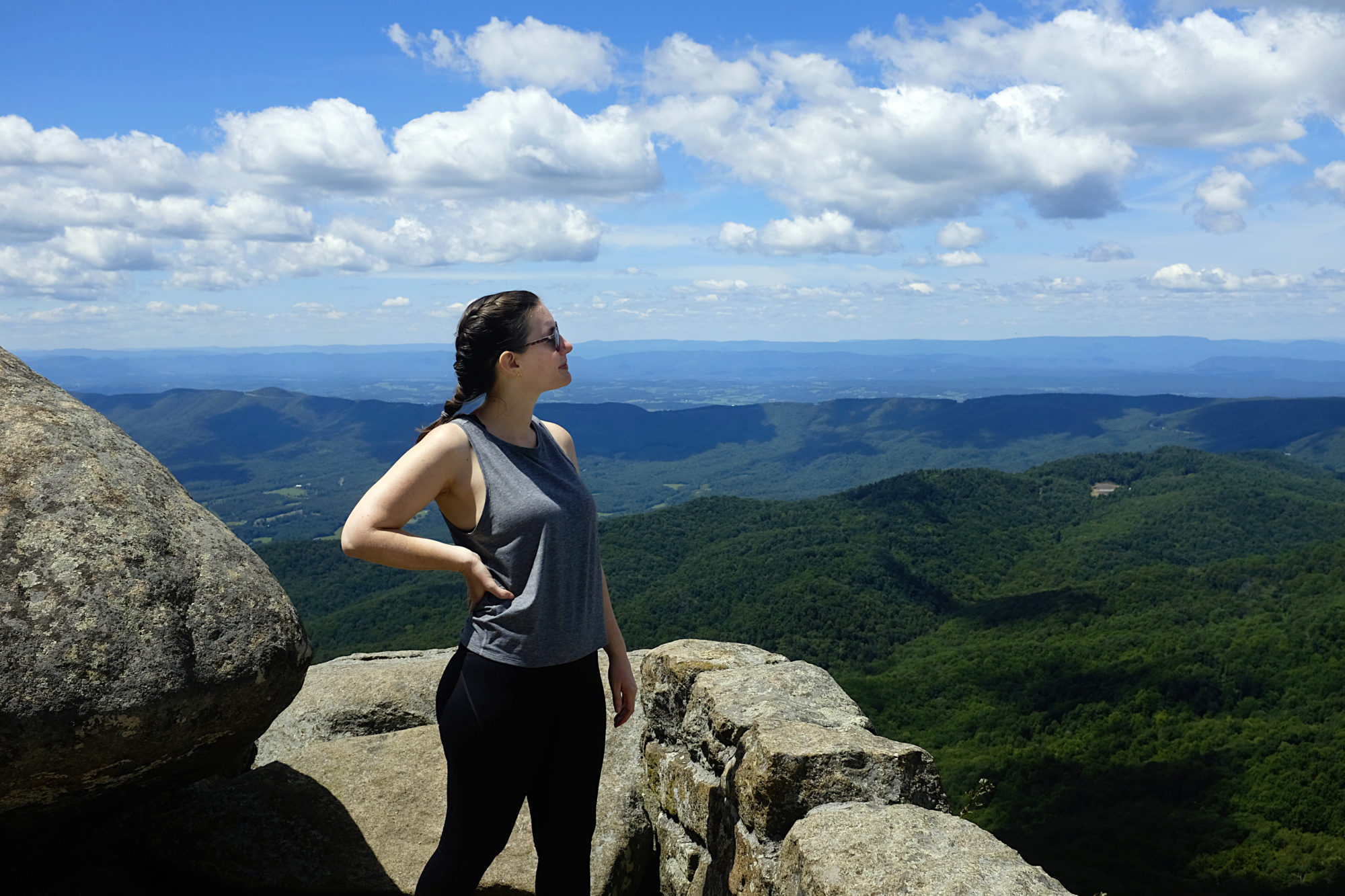 Alyssa stands at the summit of Sharp Top