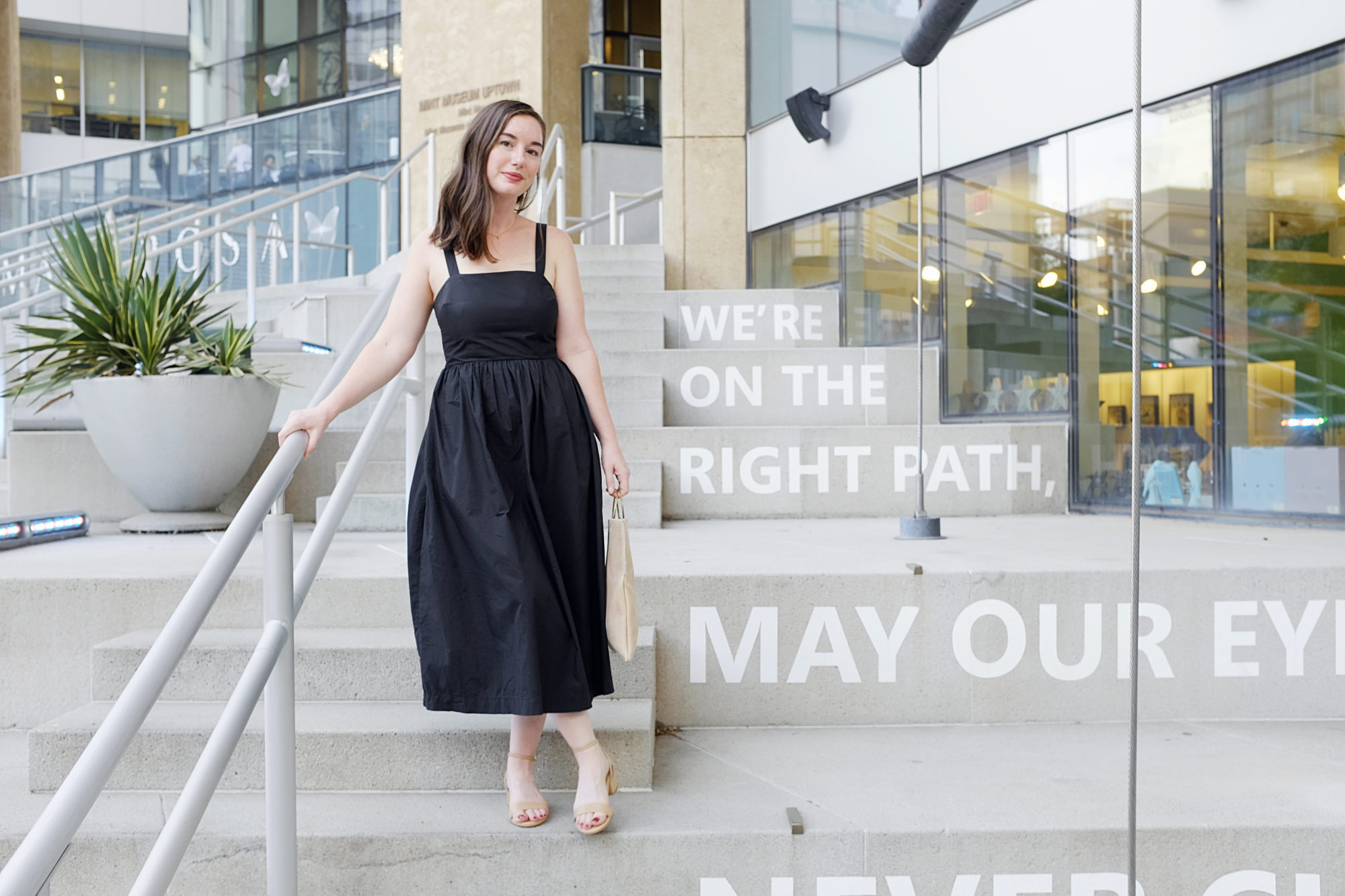 Alyssa wears the Perfect Block Sandal from Sarah Flint on a set of stairs