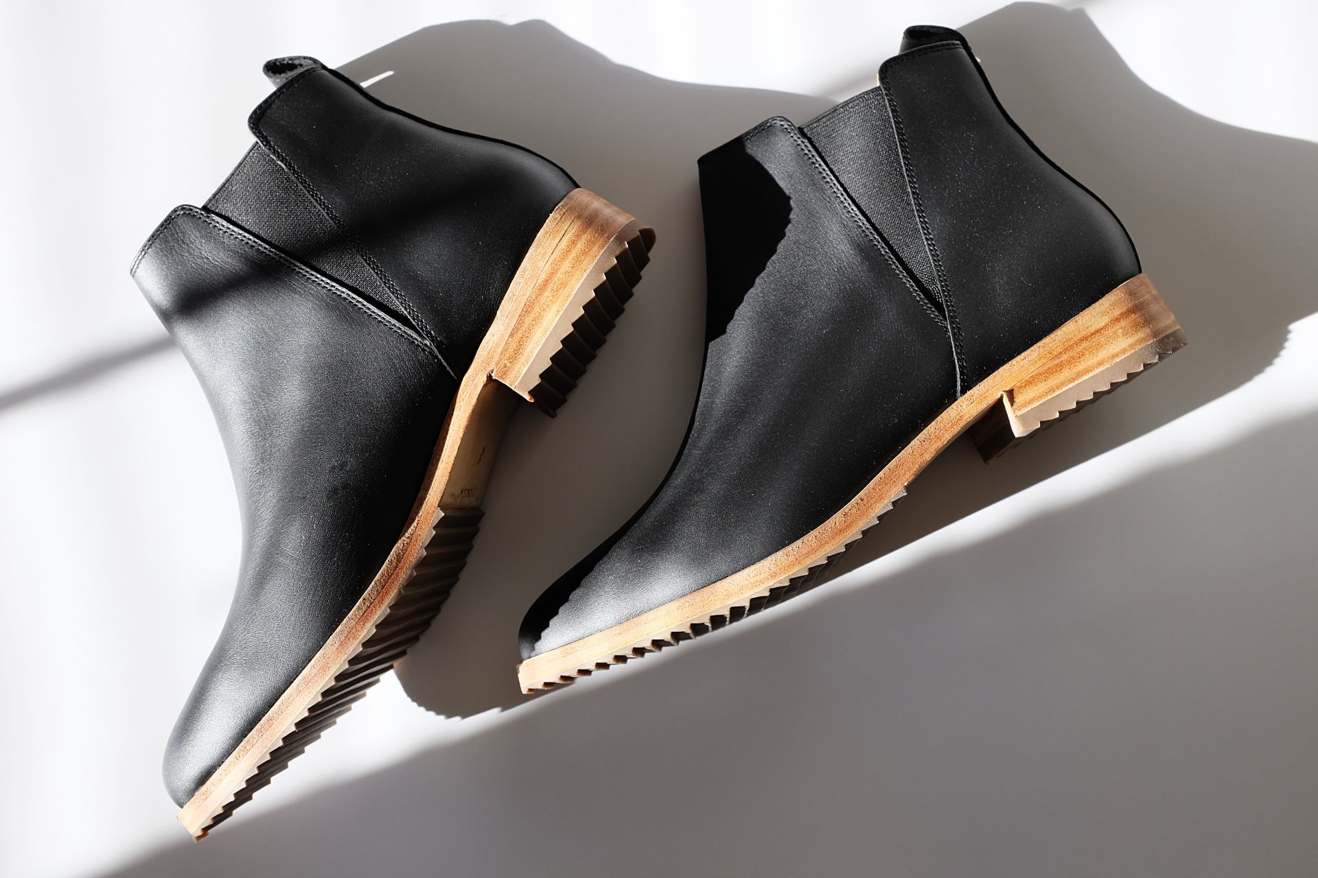 A pair of Nisolo Chelsea Boots