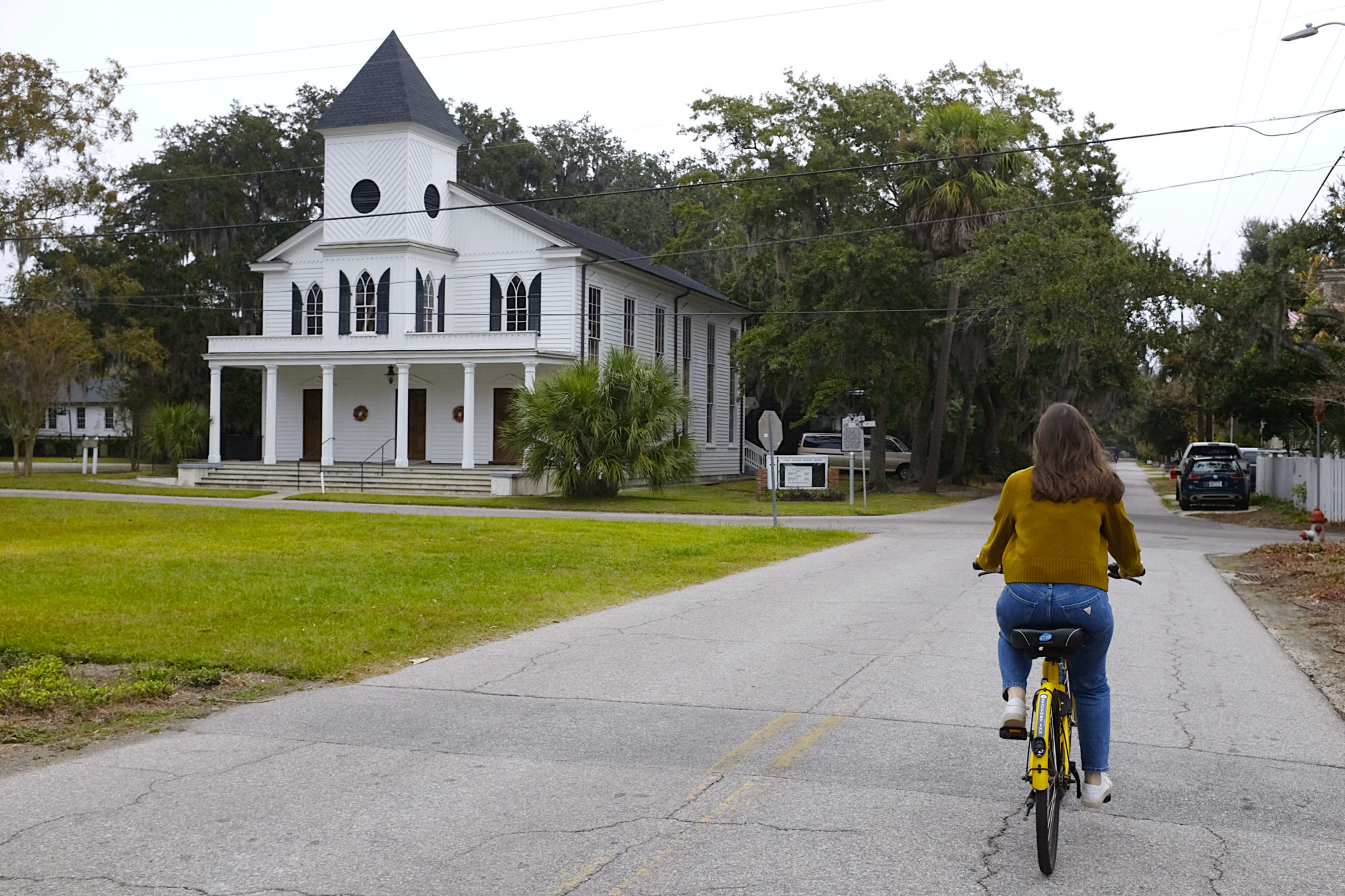 Alyssa rides a bike in downtown Beaufort