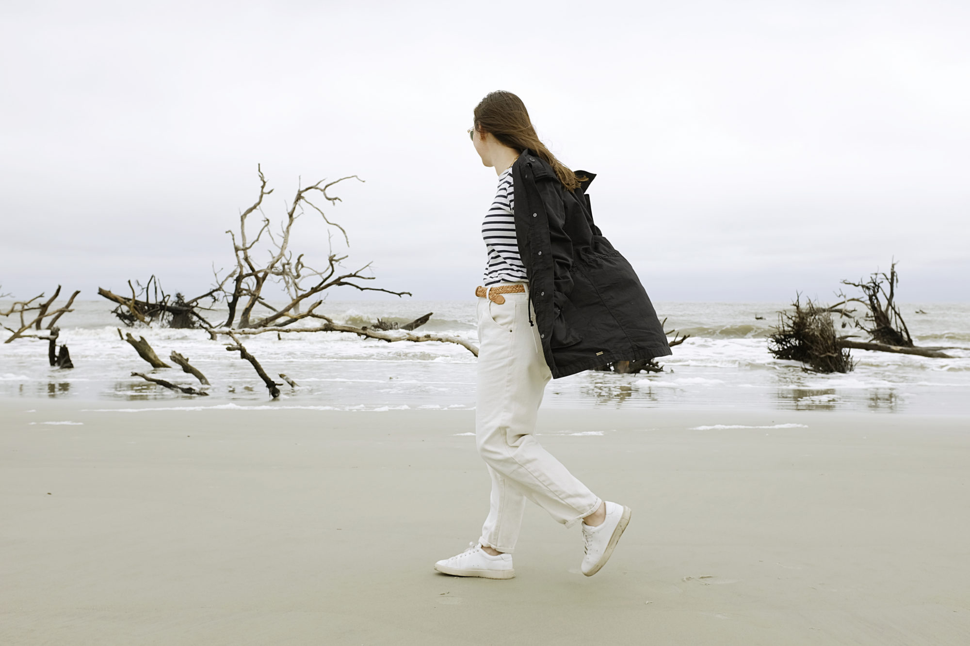 Alyssa walks on the beach at Hunting Island State Park