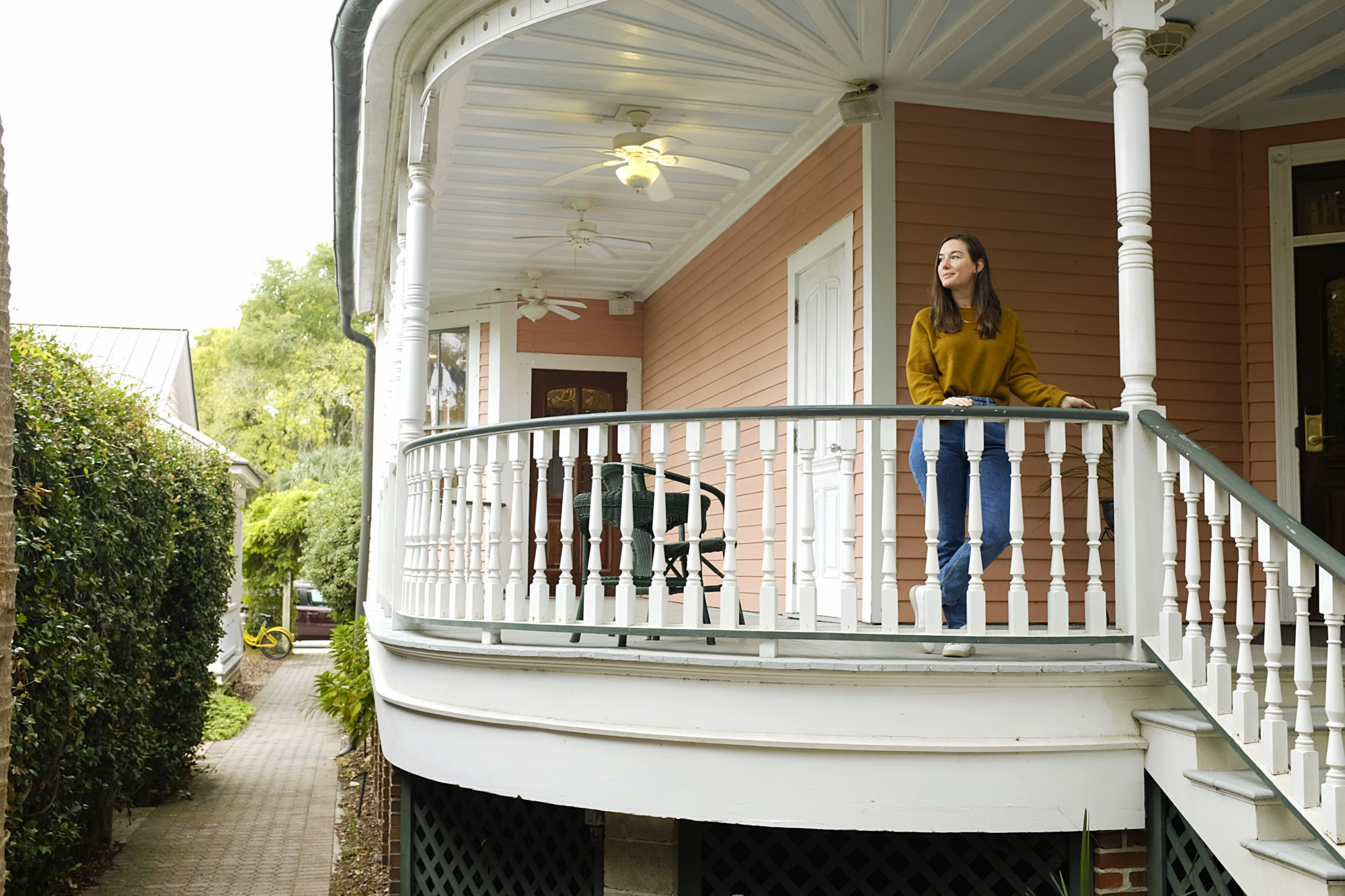 Alyssa stands on the balcony at The Beaufort Inn