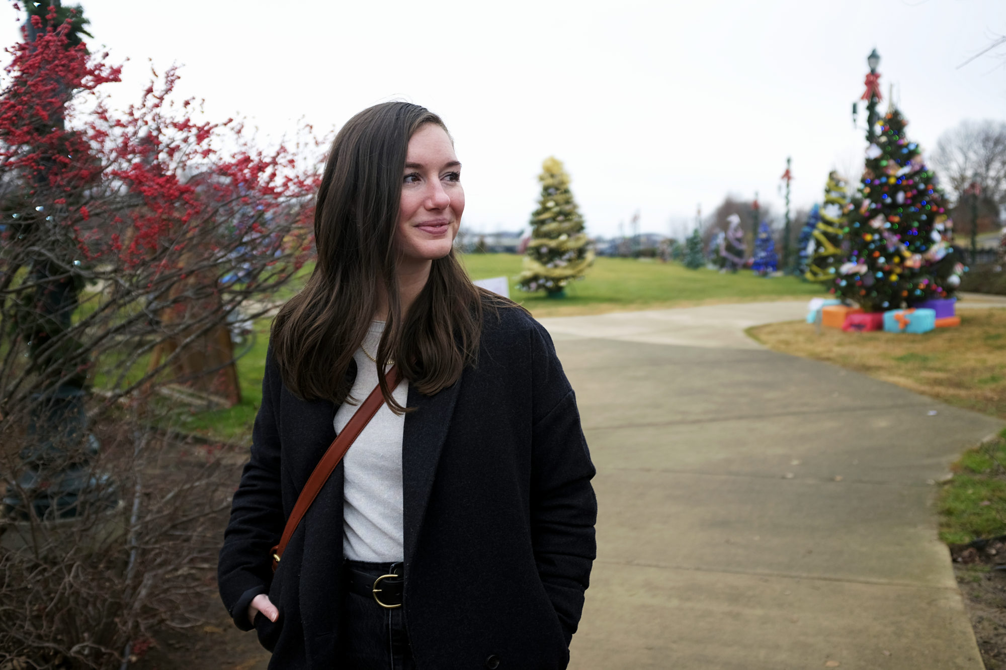 Alyssa looks at Candy Land Christmas trees