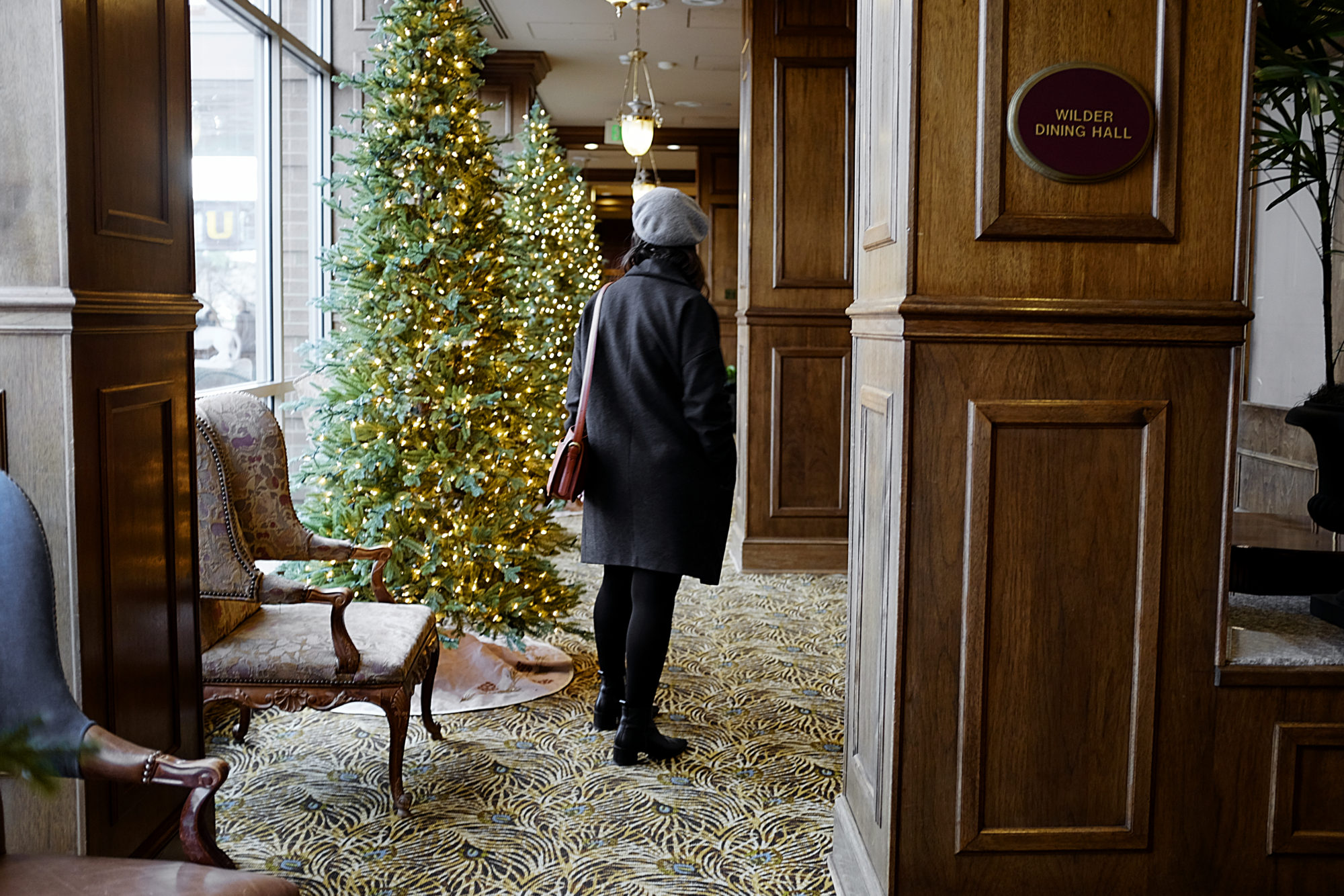 Alyssa walks in a hallway in Carnegie Hotel