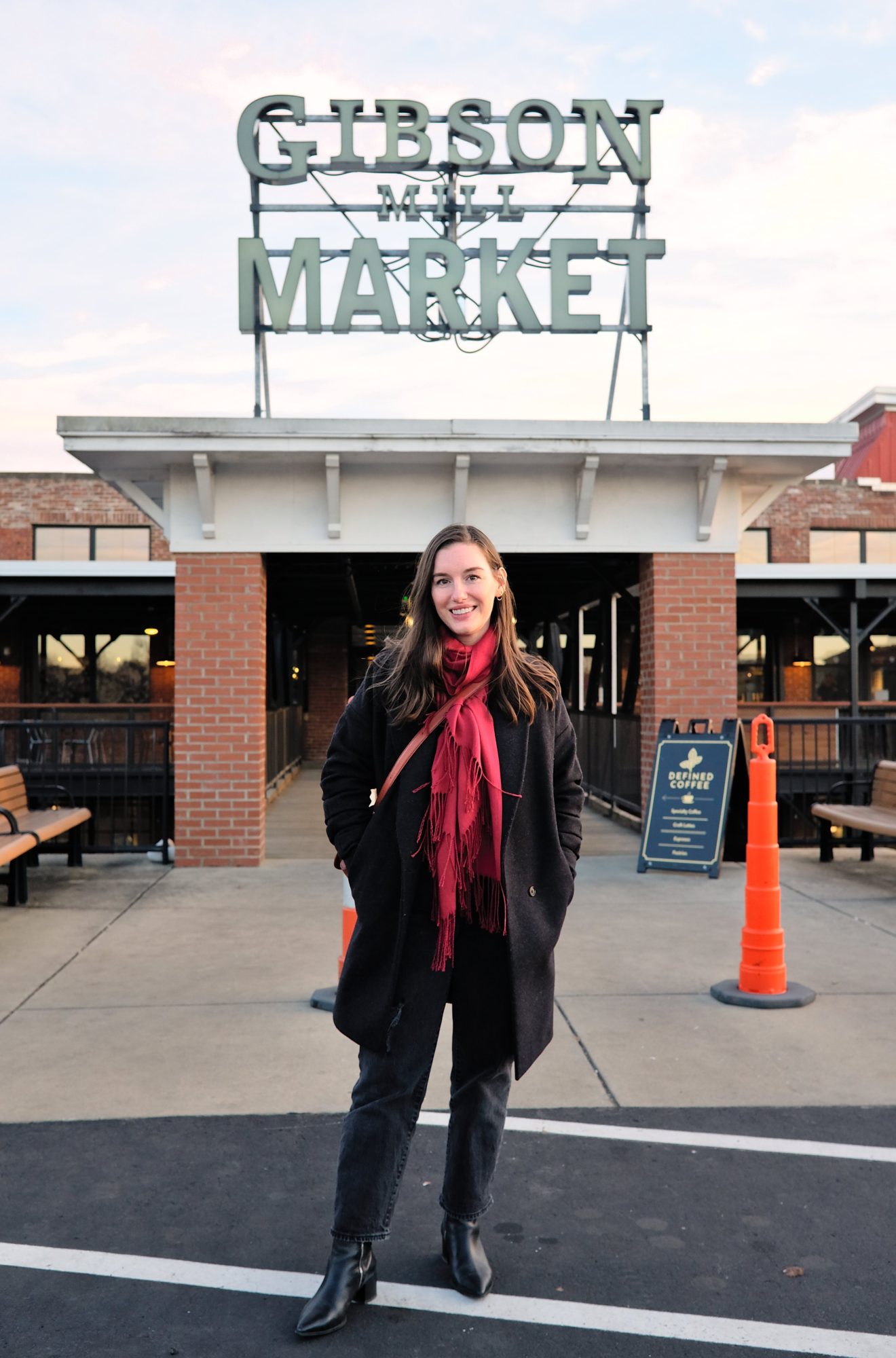 Alyssa stands in front of Gibson Mill Market