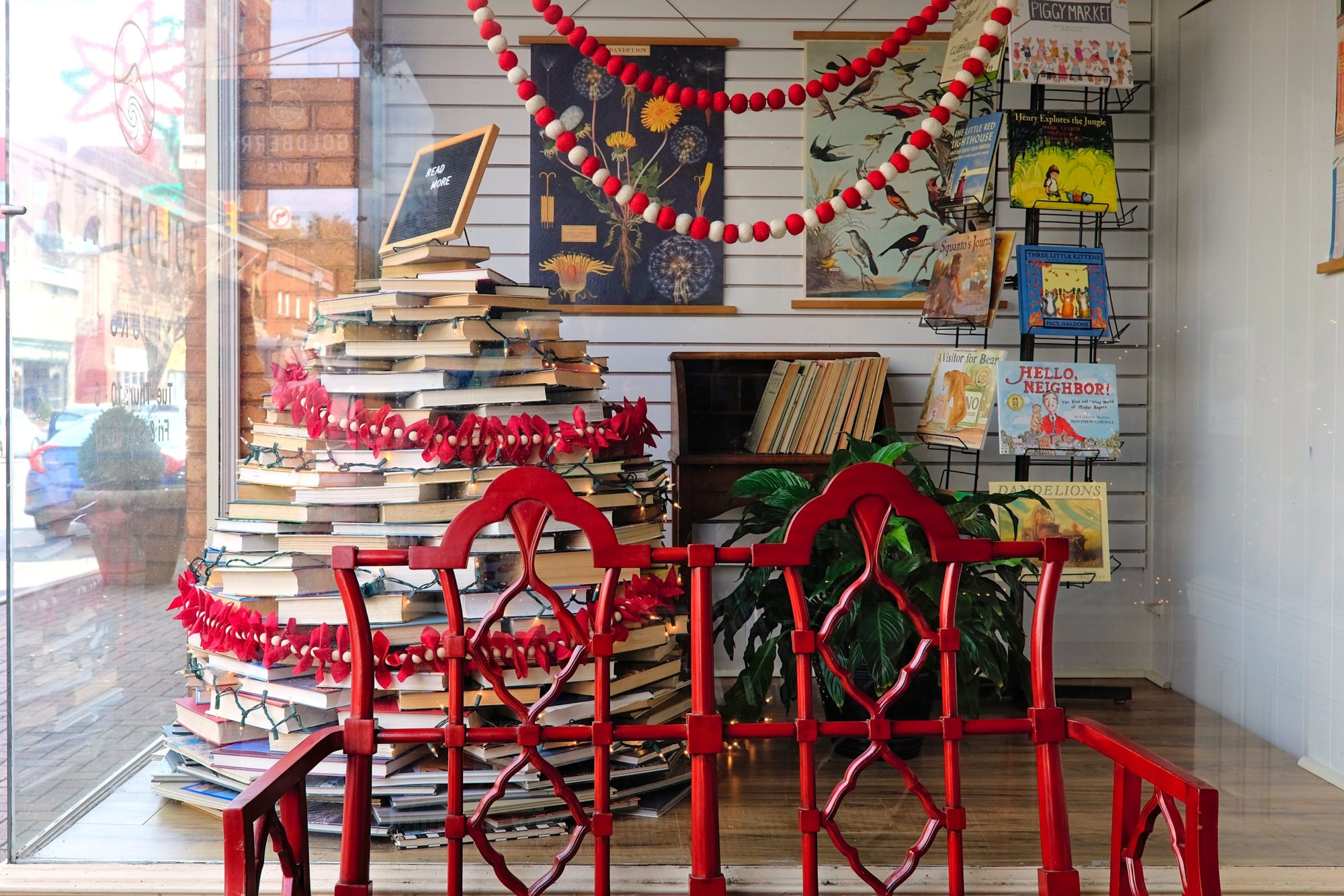 Goldberry Books' window display is a Christmas tree made of books