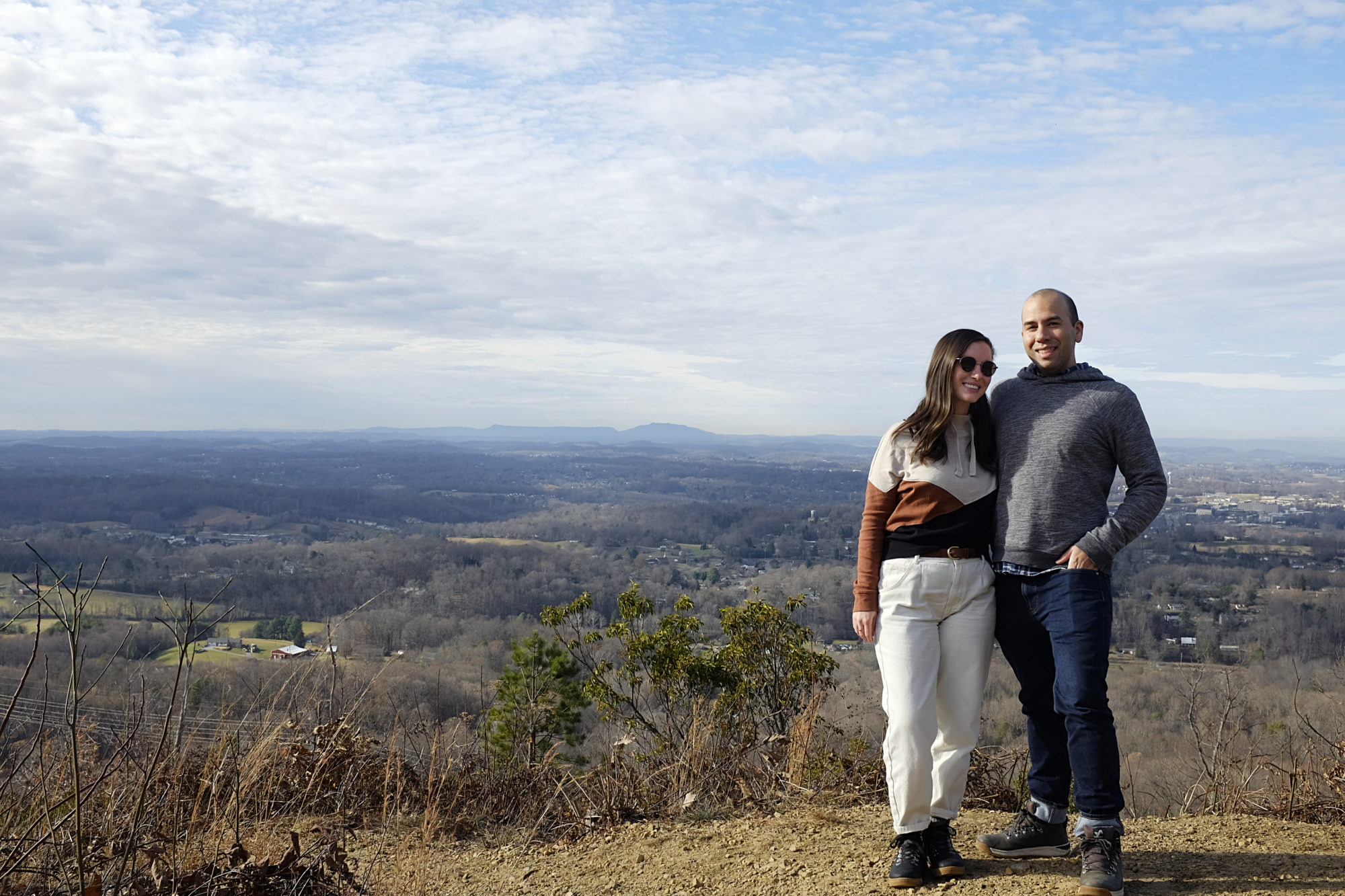 Alyssa and Michael stand at the overlook at Huckleberry Knob