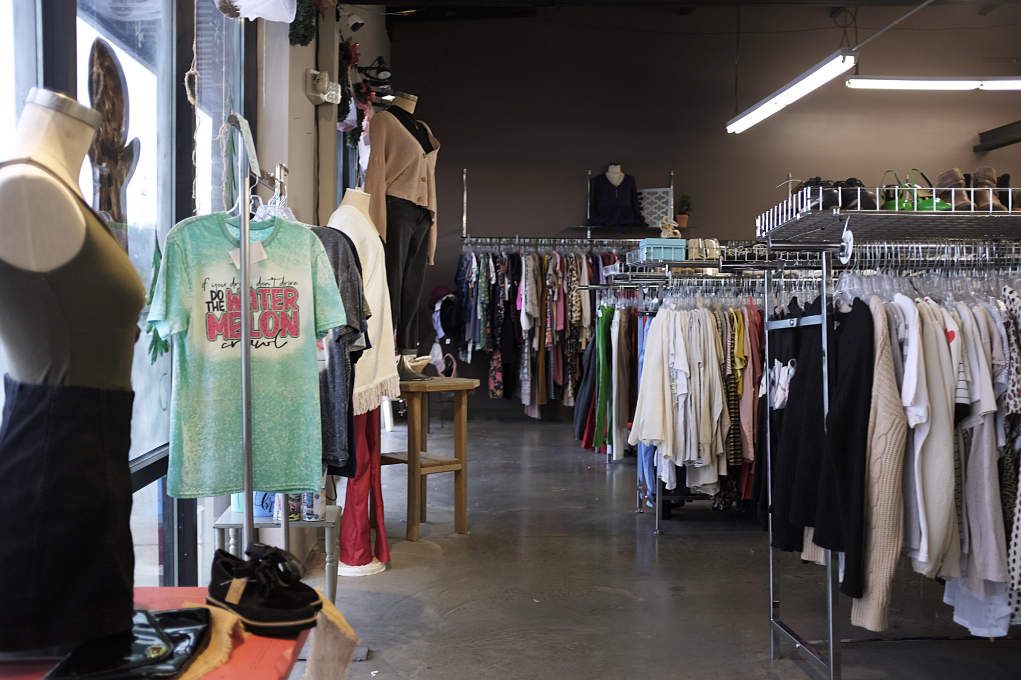 Racks of secondhand clothing at Owl's Nest Clothing & More