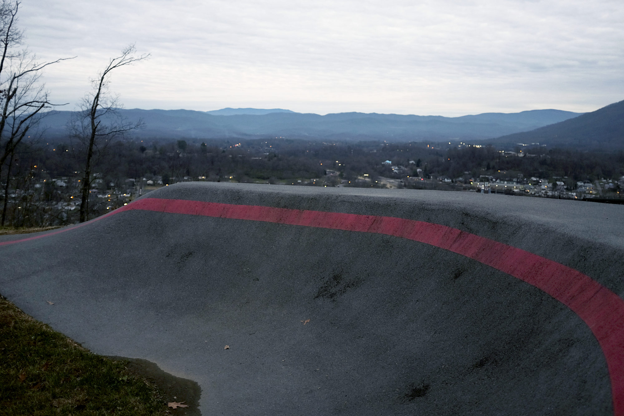 A bike ramp in the foreground and a view of Johnson City in the background from the vantage point of Tannery Knobs