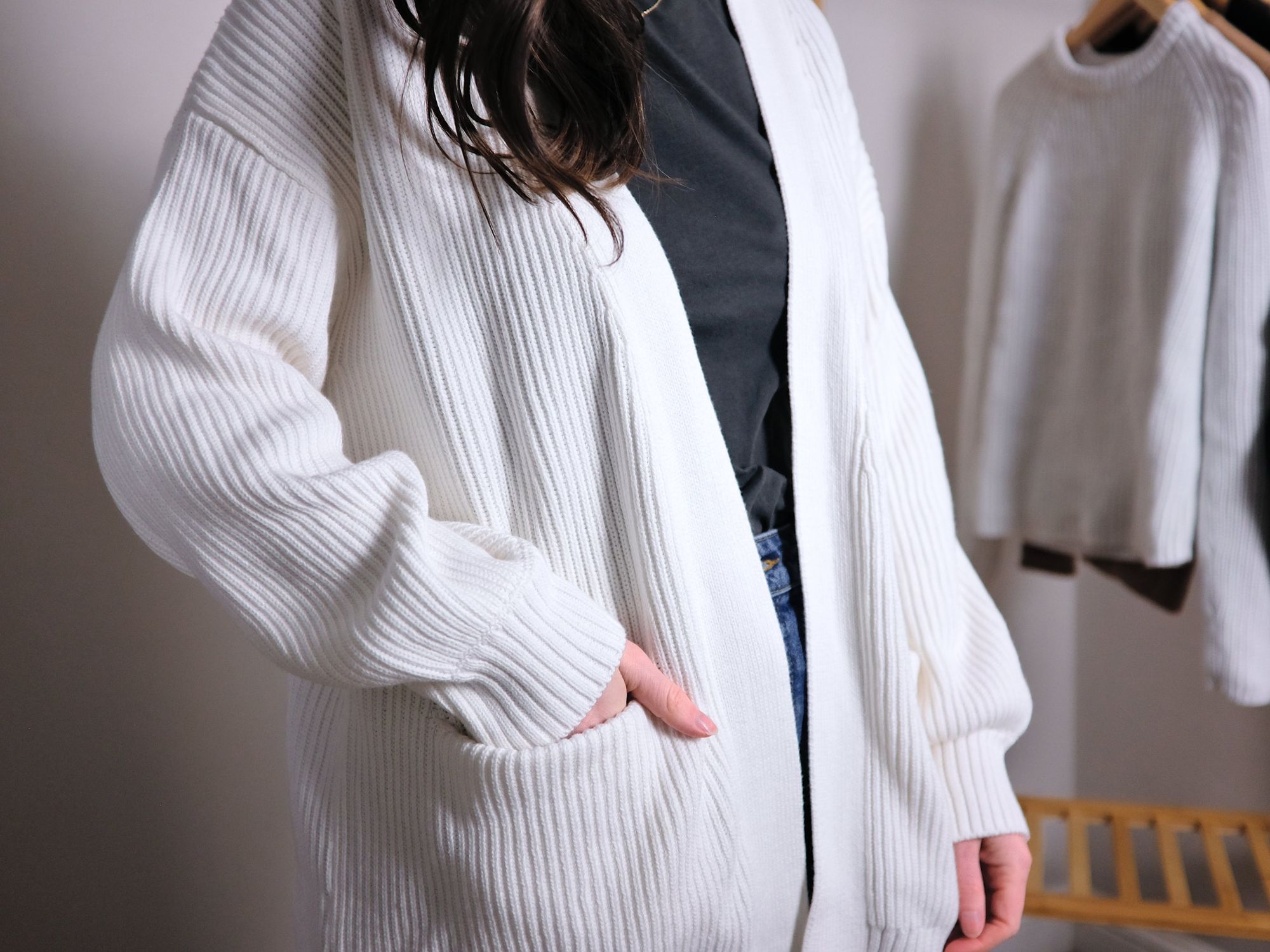 A close up of Alyssa wearing the cotton cardigan