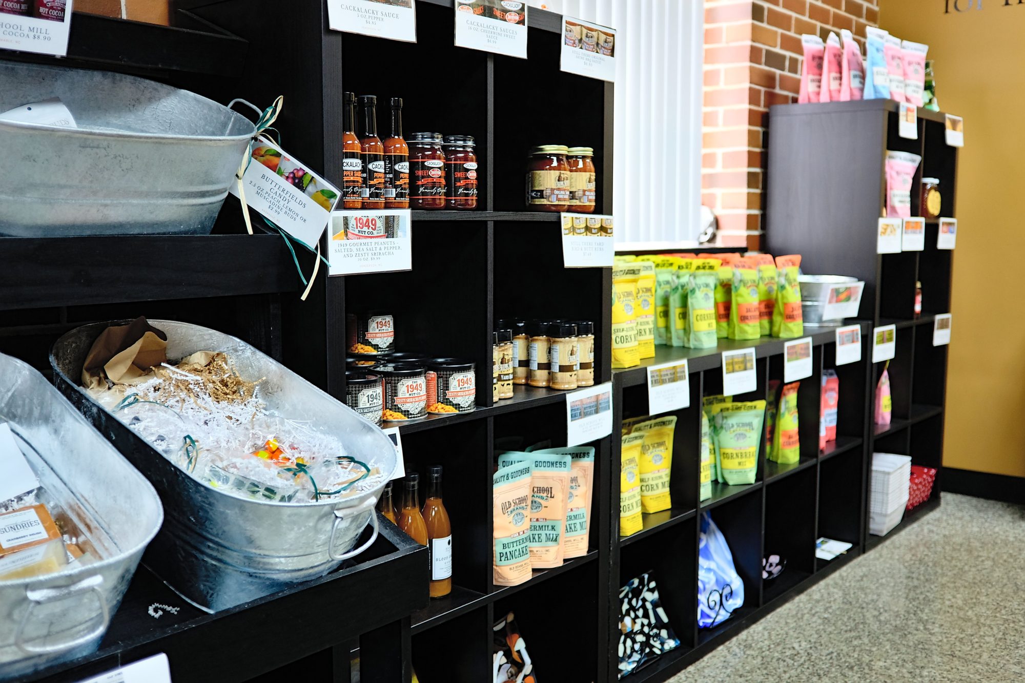 The Market at Sundries with shelves of local food and art items