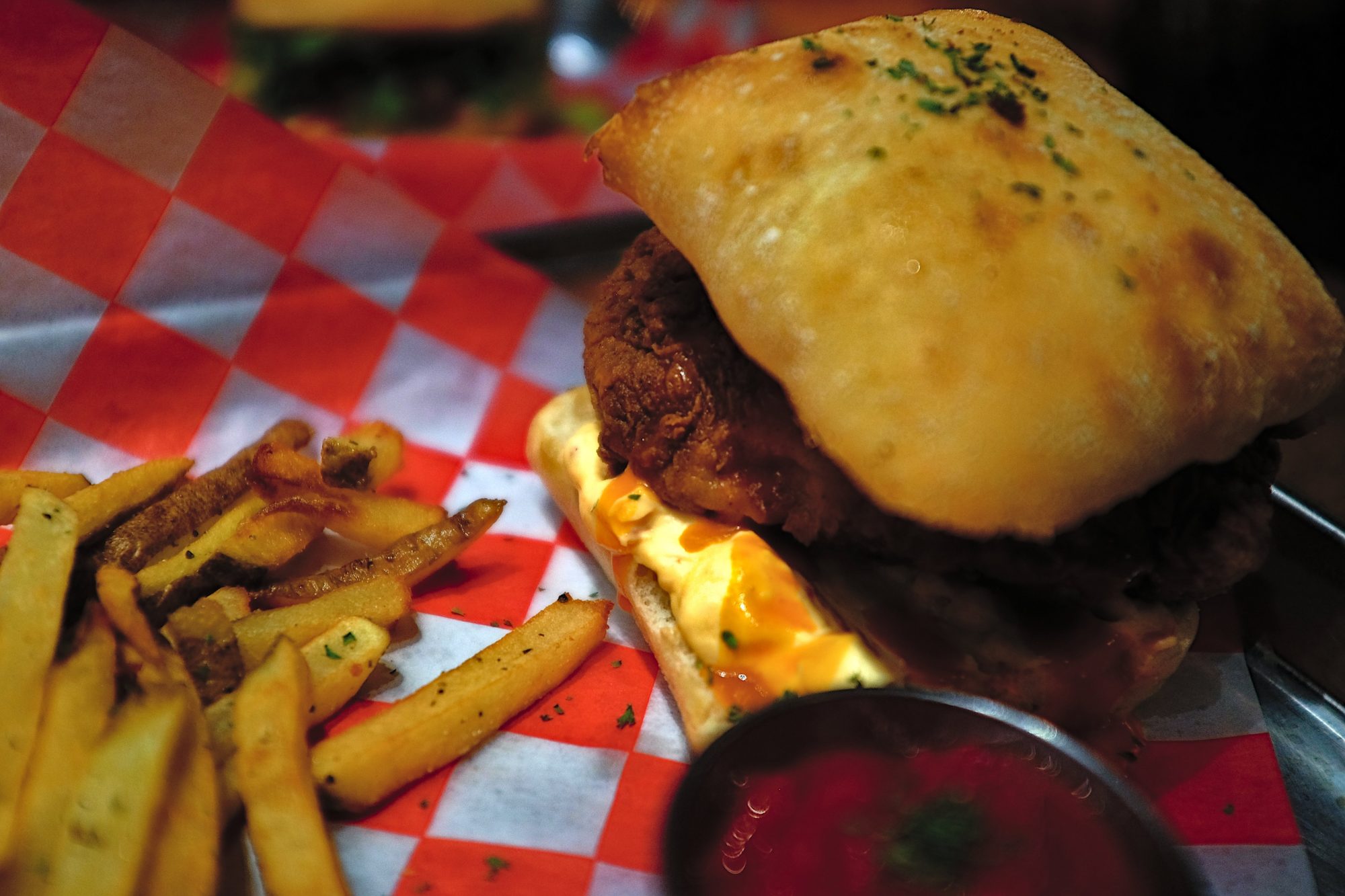 A chicken sandwich with fries