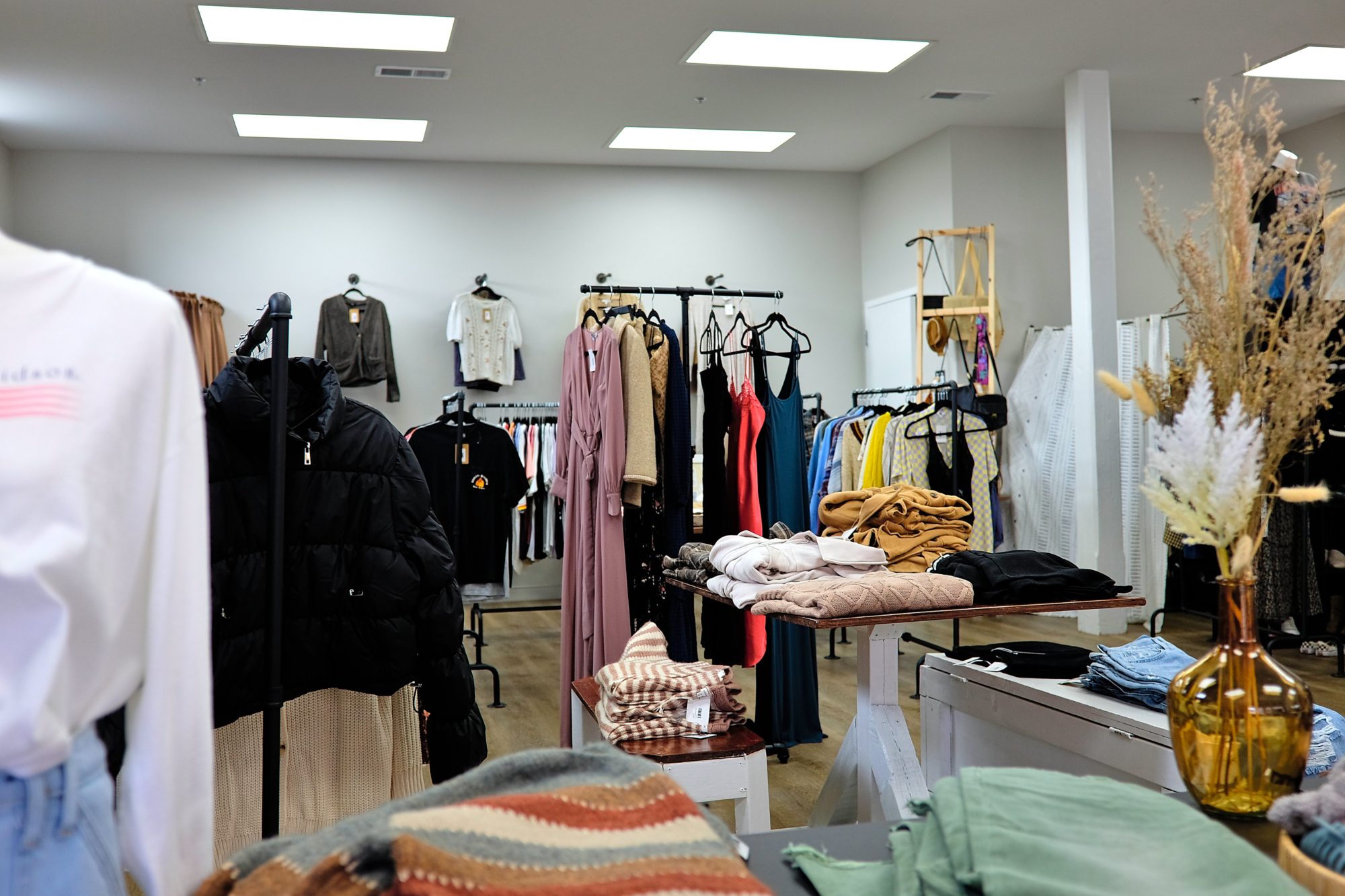 Racks of vintage and boutique clothing inside Whiskey Eunoia