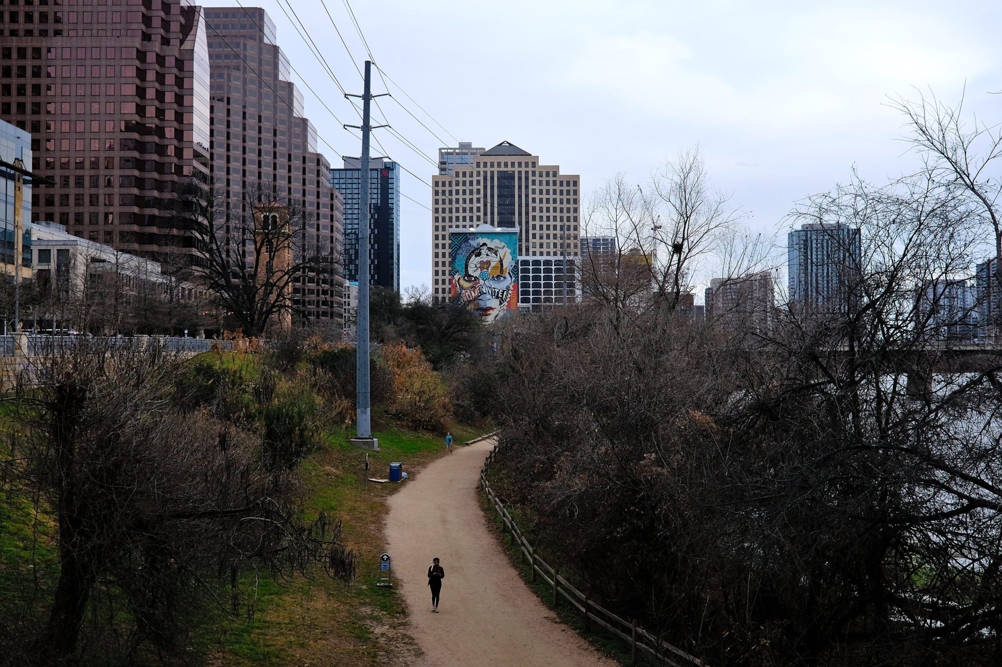 A jogger runs on the Roy and Ann Butler Hike and Bike Trail