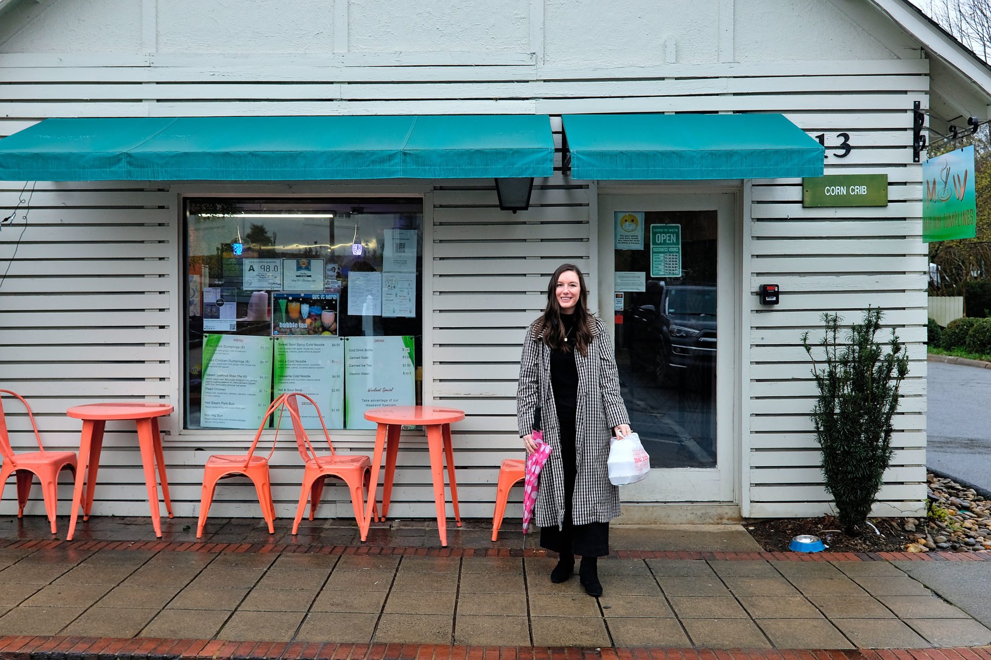 Alyssa stands in front of May Way Dumplings