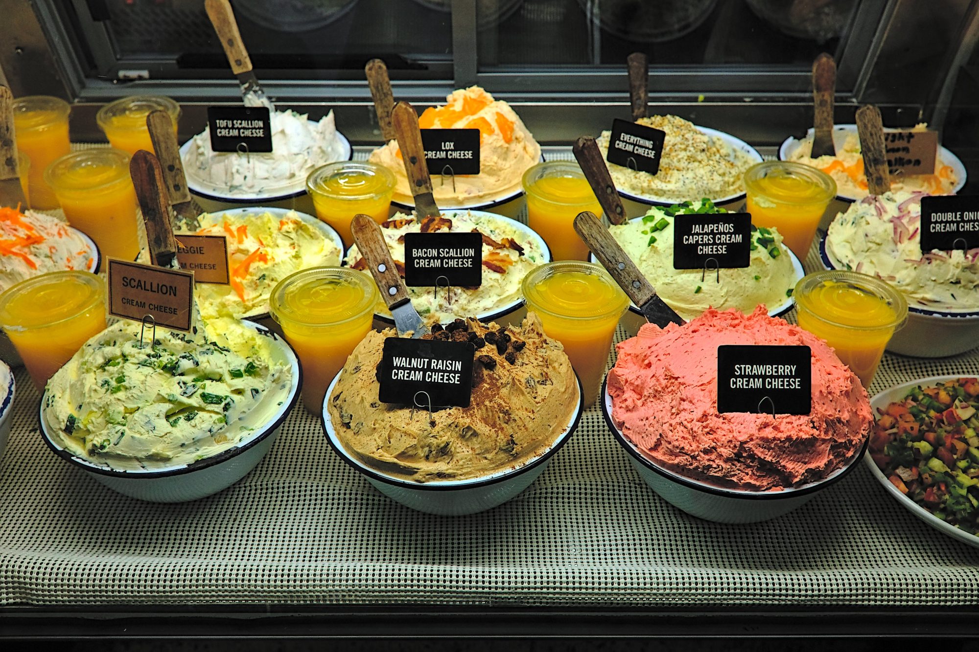 Tubs of cream cheese at Kossar's Bagels & Bialys