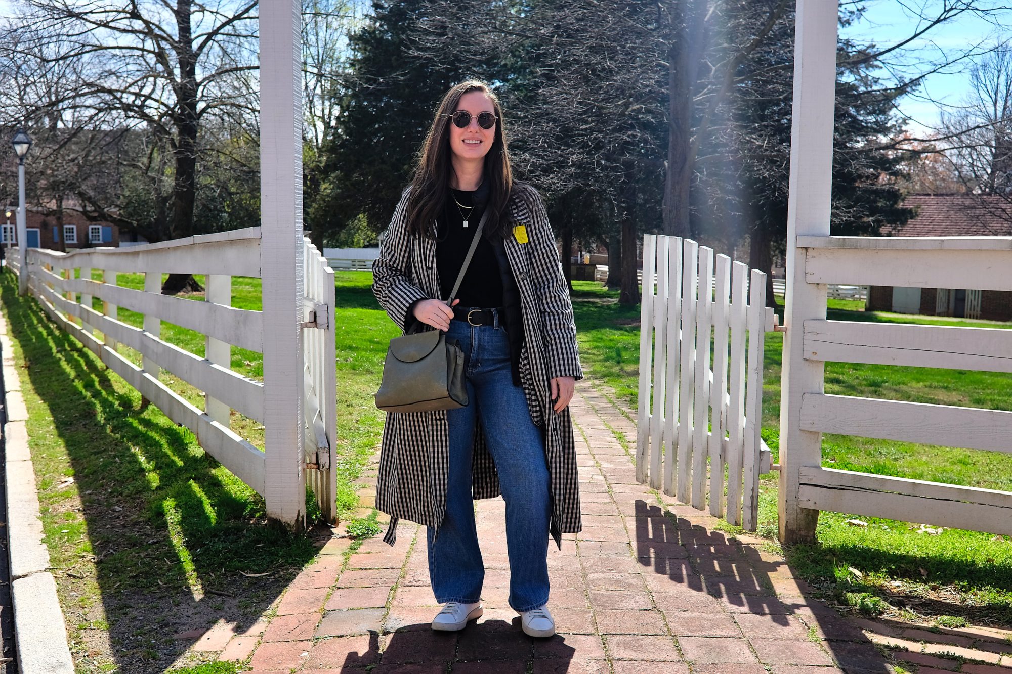 Alyssa stands in a gateway at Old Salem