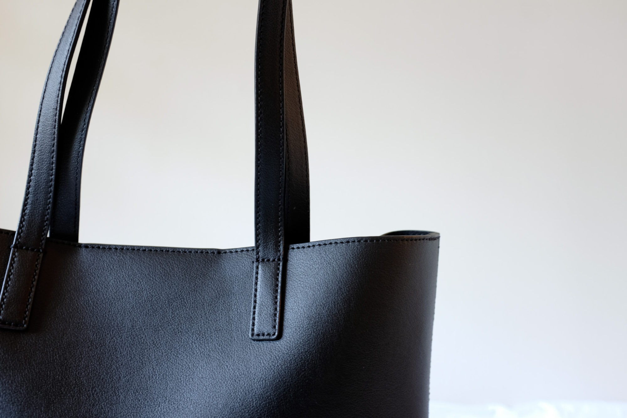 A black leather travel tote