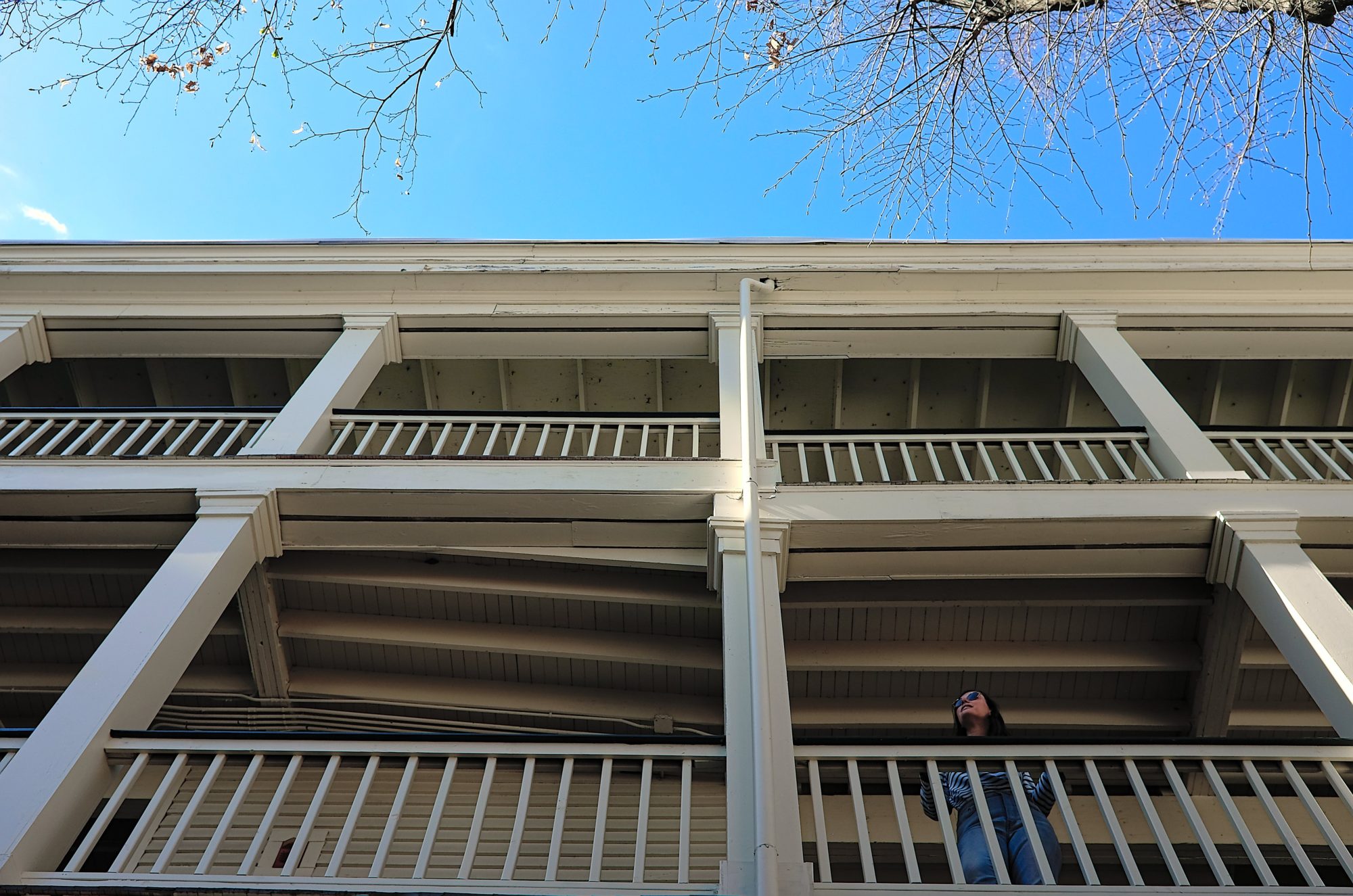 Alyssa looks out over the balcony at Linden Row Inn