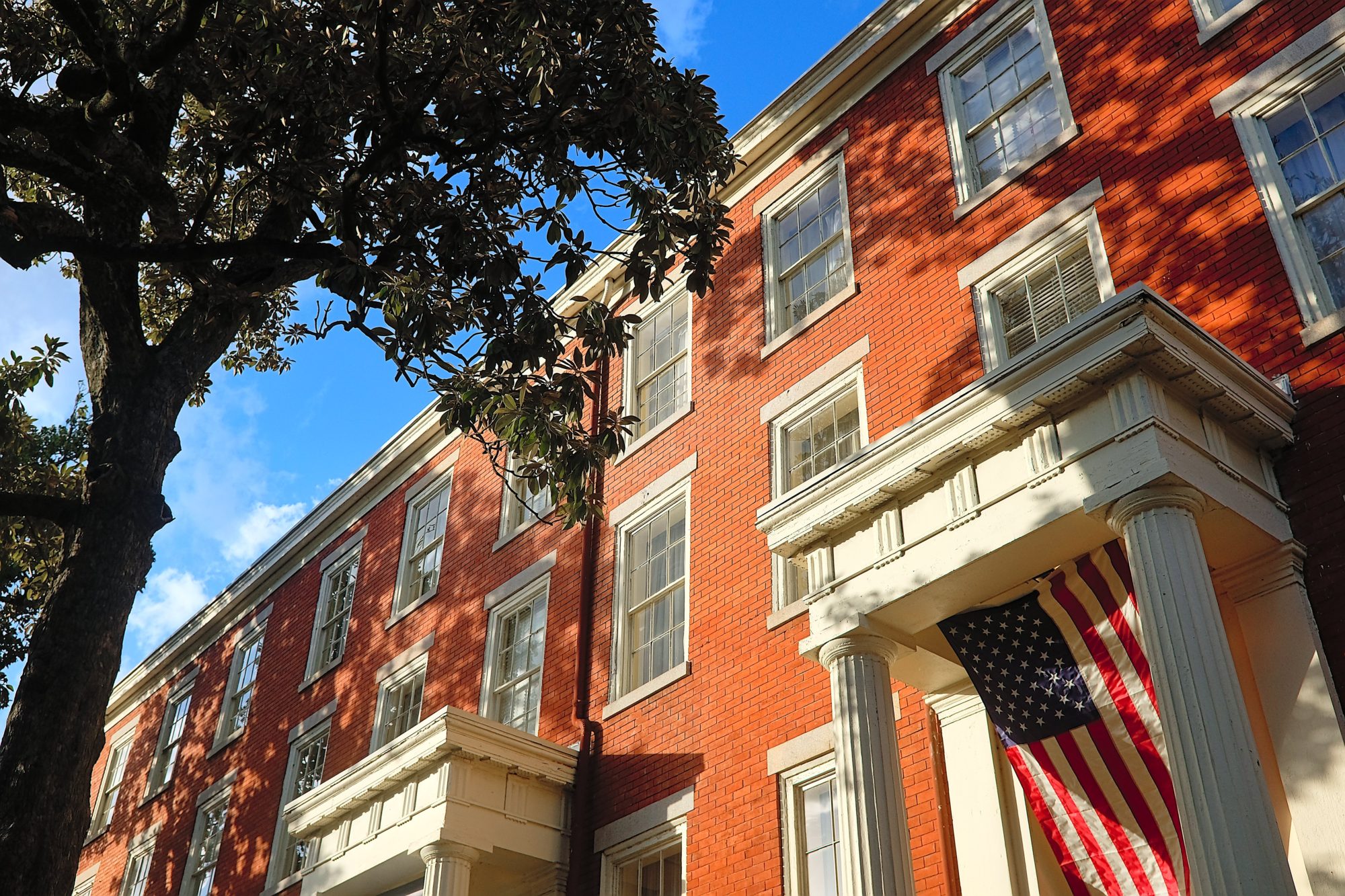 The exterior of a brick row house in Richmond