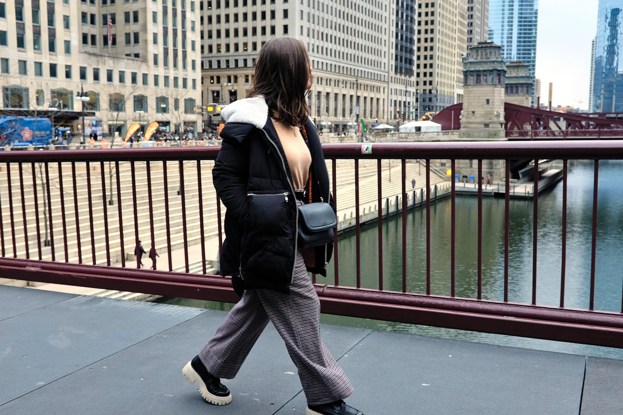Alyssa crosses the Chicago River on a bridge