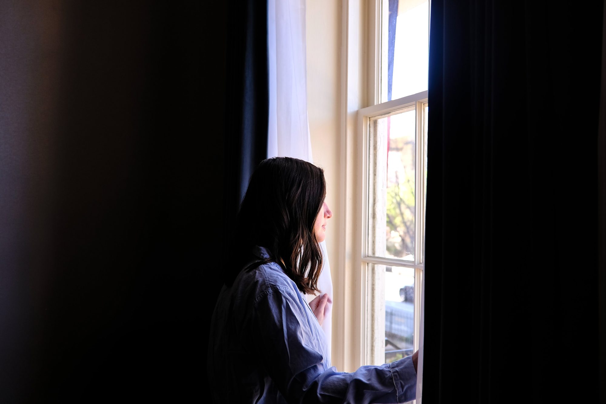 Alyssa looks out the window at the Linden Row Inn