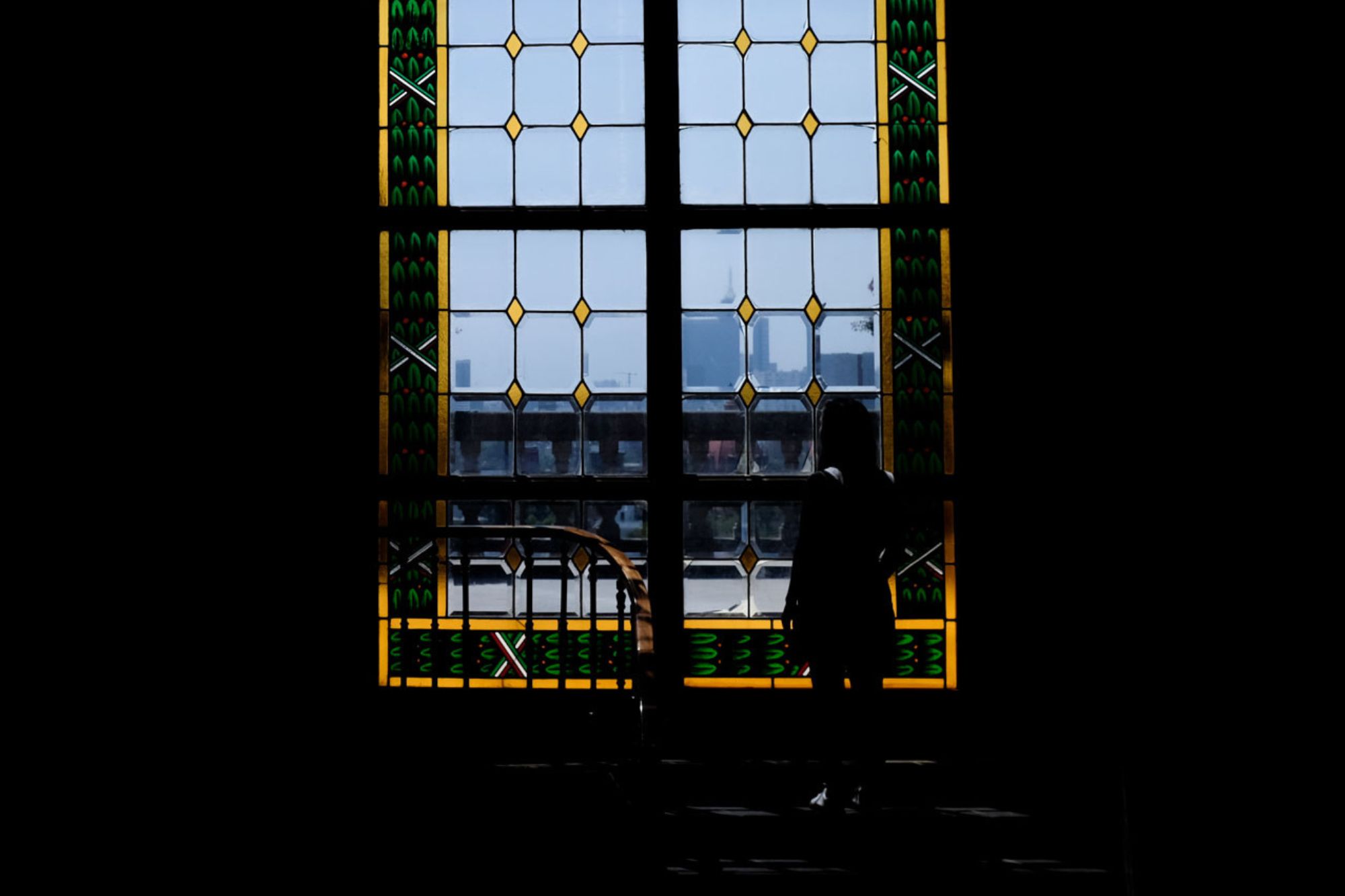 Alyssa is seen in a silhouette against a window