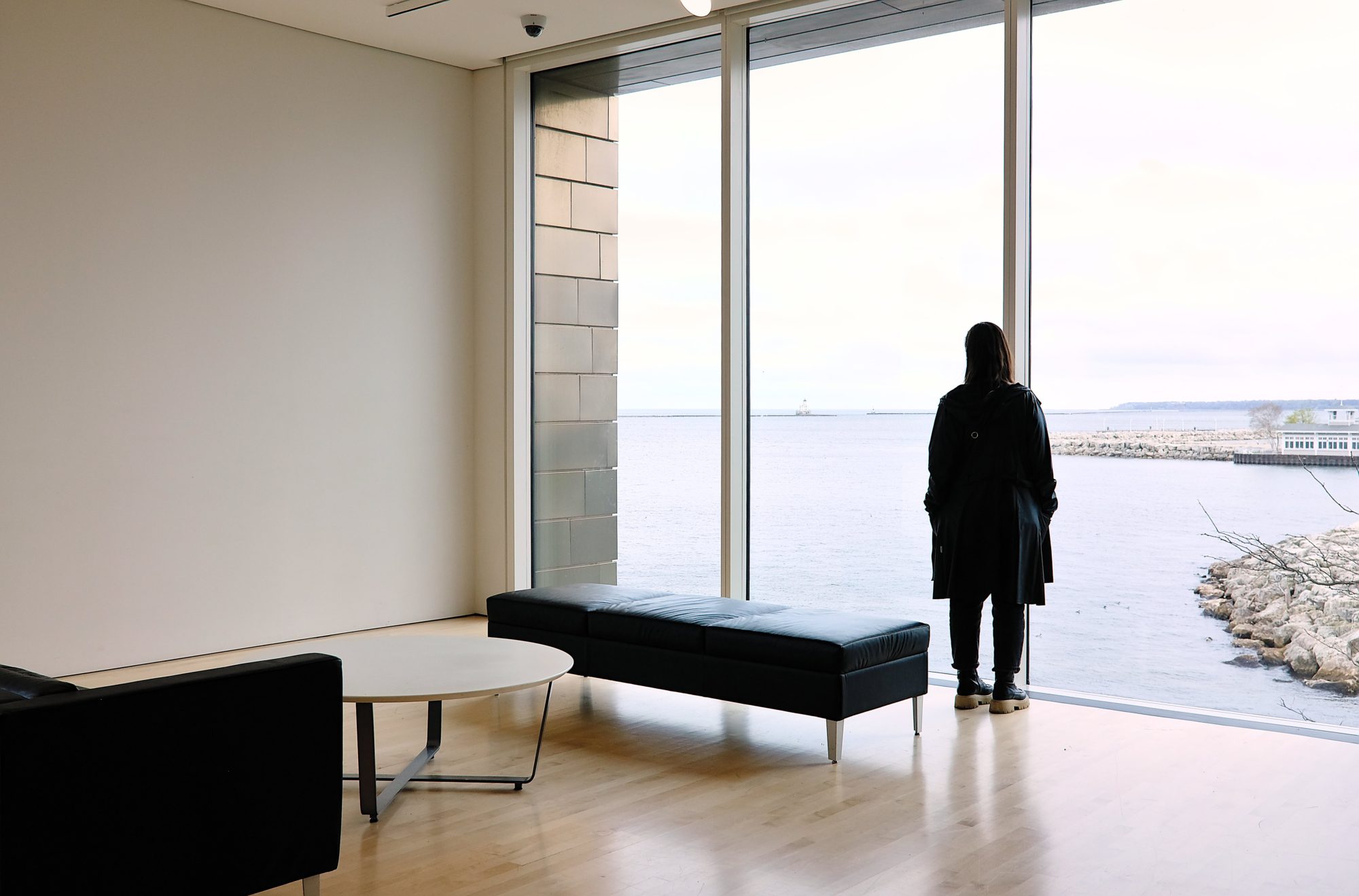 Alyssa stares out the window at Lake Michigan