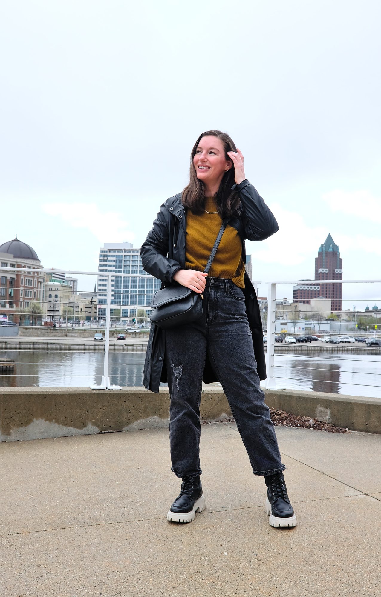 Alyssa stands near the water in Milwaukee