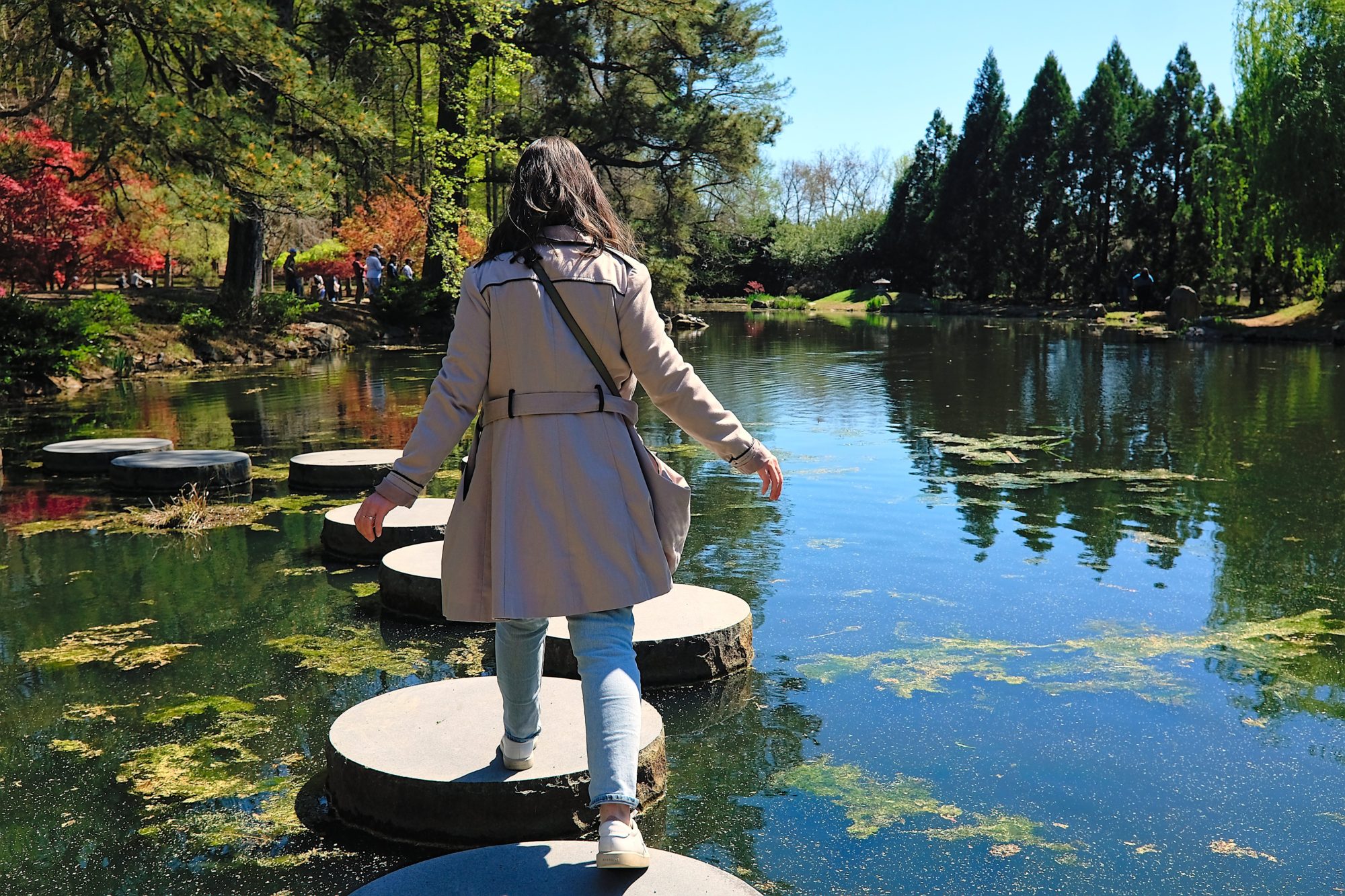 Alyssa jumps on large stepping stones in Richmond