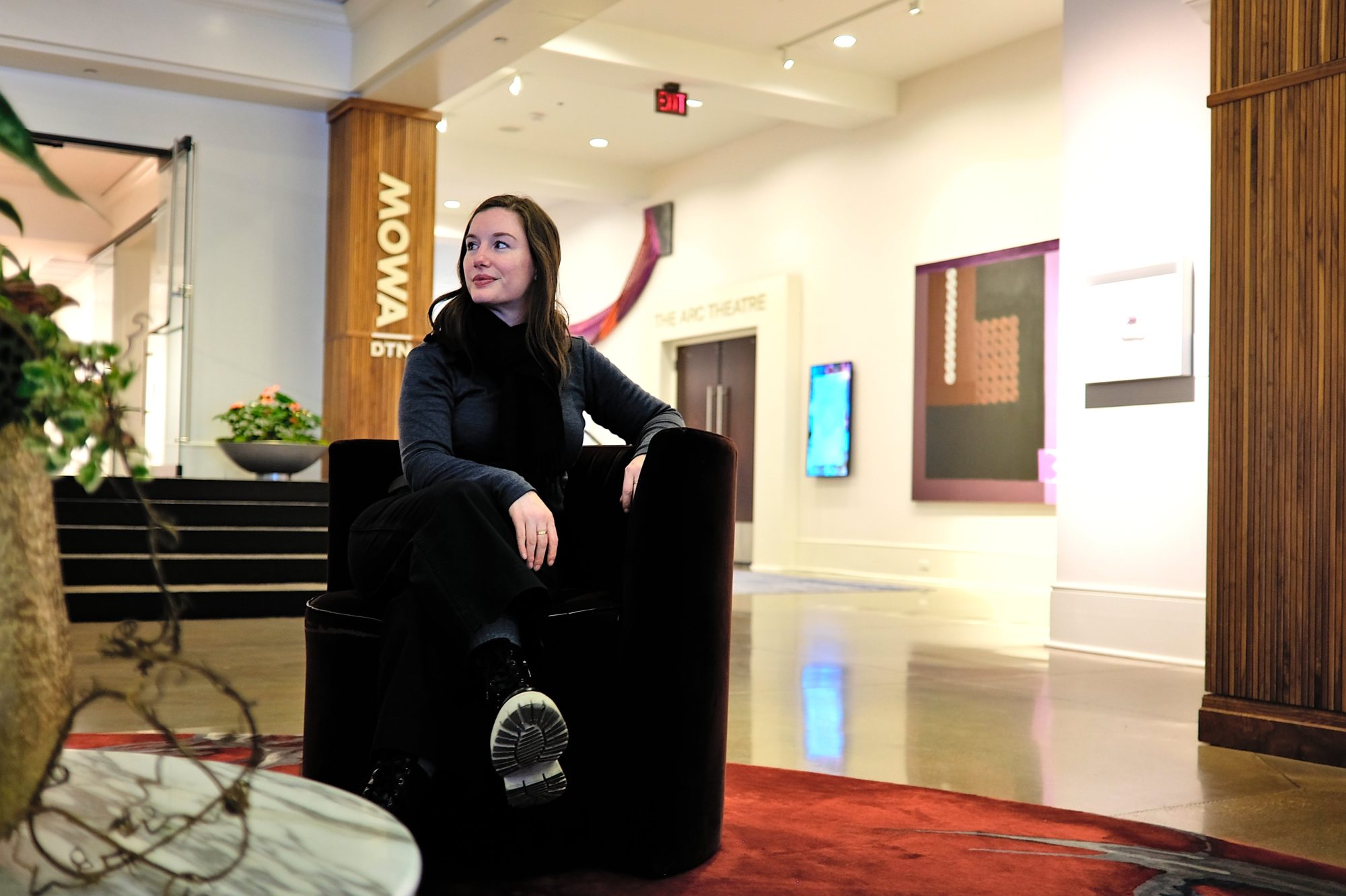 Alyssa sits in the lobby of Saint Kate