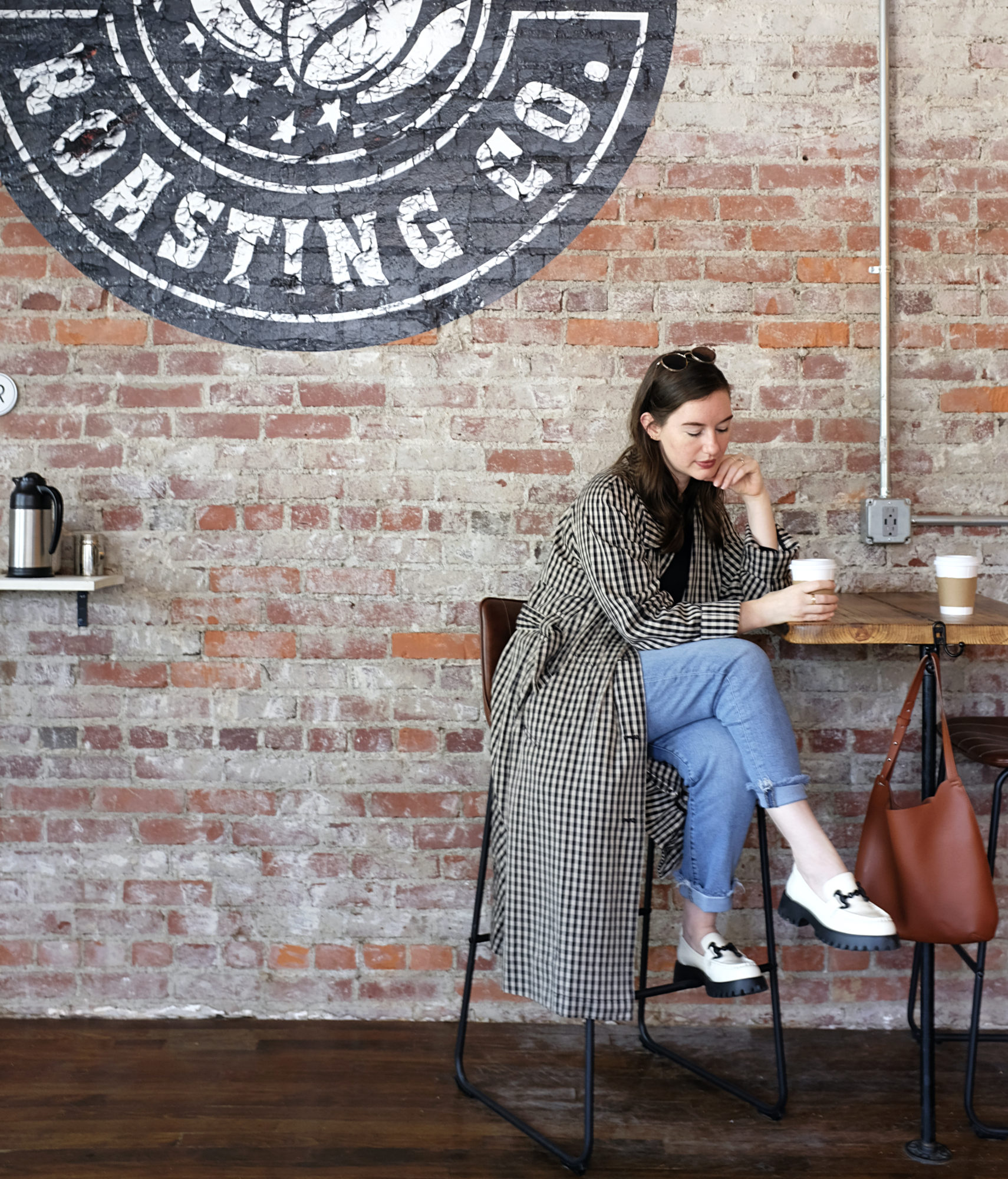 Alyssa sits in a coffee shop