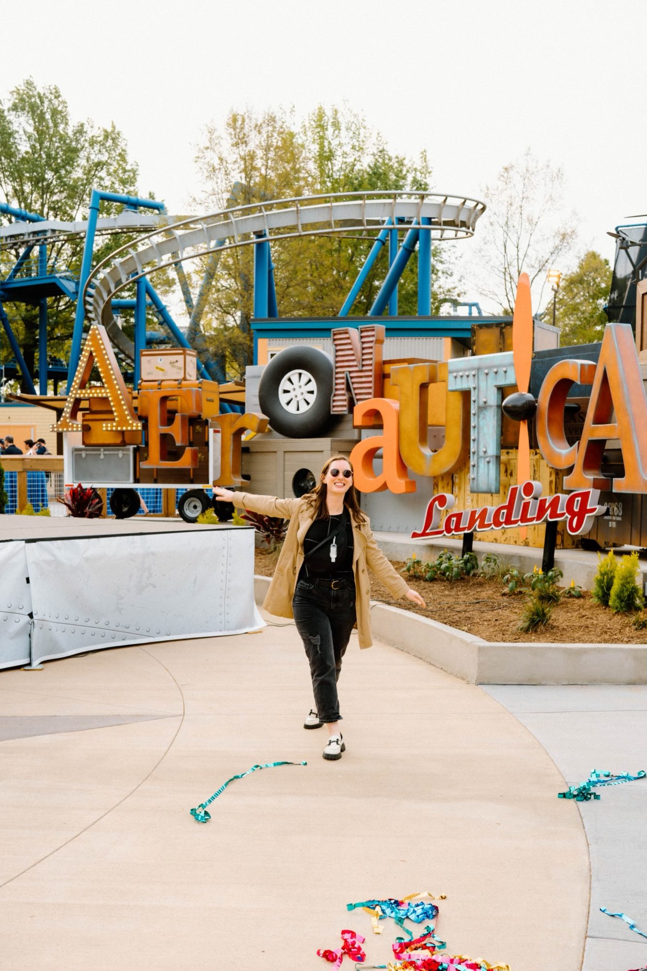 Alyssa stands in front of the Aeronautica Landing sign at Carowinds