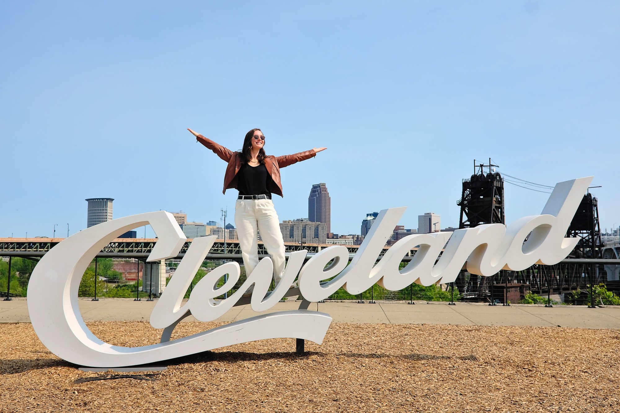 Alyssa stands on the Cleveland sign
